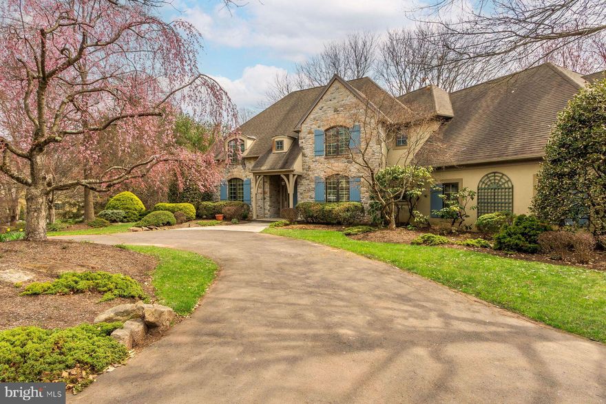 Custom Stone Manor by Zaveta | A Rare Opportunity to Reimagine. Tucked within a small enclave of distinguished homes and set at the end of a quiet cul-de-sac, this custom-built stone manor by Zaveta offers timeless architecture, privacy, and exceptional potential. Designed with both scale and livability in mind, the home features a first-floor primary suite with a tray ceiling, complemented by gracious living spaces throughout. The living room with fireplace, skylights, and French doors opens to a peaceful yard, filling the home with natural light and a seamless indoor-outdoor connection. A formal dining room, library with custom built-in bookcases, and a bright kitchen overlooking the gardens provide a classic yet highly functional layout. A first-floor laundry room adds everyday convenience. Upstairs, three additional bedrooms, two full baths, and a lofted family room create flexible living space, while a cedar closet offers thoughtful storage. Additional areas present the opportunity to customize for a gym, wine cellar, craft or creative studio. Set on a beautiful, private lot surrounded by preserved land, the property enjoys a rare sense of tranquility and natural beauty. A three-car garage and separate garden shed complete the offering. This home is in need of renovation, but offers exceptional bones, scale, and craftsmanship—a rare chance to update and elevate a Zaveta-built residence to its next chapter.