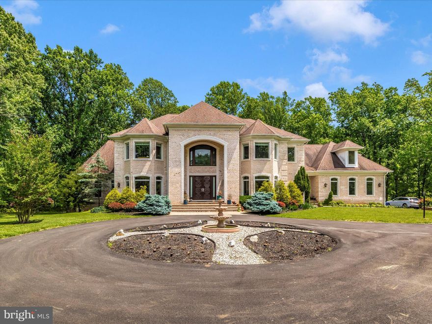 Please submit your best offer by Wednesday at noon. Openhouse is canceled for next Sunday.

Situated in the sought after River Hill school district, this estate residence covers a 5.5-acre lot and offers 12,457 square feet of luxurious living space with high end finishes and amenities. This home is a fusion of luxury and functionality, designed for both grandeur and practical living.  The home includes 7 bedrooms and 8 bathrooms, along with a completely finished basement, making it ideal for extended or multi-generational families. The home features hardwood floors on the main and upper levels, a spacious 3-car garage, and a large driveway that can accommodate about 5500 square feet, offering plenty of parking space.  The expansive outdoor area presents various possibilities for activities and leisure.

MAIN FLOOR - Step through the Barcelona-imported, intricately carved wooden doors into a realm of sophistication. The grand two-story foyer immediately captivates with its luxurious marble floors and elegant staircases ascending on both sides. The house reveals a stunning open design, guiding you to a formal living and dining area, each enhanced with tasteful lighting coves. Beside the living room lies a bright conservatory or study, and a functional double-sided Butler's pantry adjoins the dining room. The family room, a two-story wonder, features a striking dual-sided fireplace and leads to a sunlit sunroom and a vast 36-foot deck. At the heart of this home is the gourmet kitchen, complete with a large breakfast bar, pristine granite countertops, custom 42-inch cabinets, and top-tier stainless appliances, including a Sub-Zero refrigerator. For convenience, there are two kitchen areas: a primary one for entertaining and a secondary, fully-equipped chef's kitchen for daily use. Savor peaceful backyard views from the breakfast room or the connected sunroom, highlighted by tall windows with graceful arched transoms. The master suite is a retreat of comfort, offering a tray ceiling, personal wet bar, and a snug sitting area with deck access. The luxurious en-suite bath, featuring a sumptuous soaking tub and glass shower. The suite is completed with spacious walk-in closets, perfectly organized. 

UPPER LEVEL - Take the secluded rear staircase to the expansive upper-level sleeping area, where you'll find an additional family room and an open overlook. This level features four private en-suite bedrooms, each uniquely designed with bump-out details for added character and space. 
BASEMENT - The fully finished lower level is an entertainment haven, featuring a welcoming foyer that leads into an expansive family room. It's perfectly equipped for leisure with a billiards zone, gaming space, media area, and a full-service entertainment bar. This level also includes two additional bedrooms and a shared full bathroom, providing a comfortable space for overnight guests. A highlight of this area is the double walk-out leading to a covered patio, which opens up to a splendid rear outdoor living area and a separate, covered pavilion. For wellness and work, there’s a dedicated exercise room and a professional office. The utility room and additional storage closets ensure practicality and convenience. This home is further enhanced by a main level laundry room, sturdy custom steel framing, and rich Brazilian cherry floors. 
OUTDOOR - Relax on the welcoming front porch, the perfect spot to enjoy sunsets and take in the neighborhood views. Experience the epitome of leisure on the luxurious, concrete deck, offering a private retreat in the expansive backyard, ready to cater to any entertainment scenario you can imagine. Trees provide an extra layer of privacy.  This opulent home is the epitome of luxury and comfort, featuring all the amenities you could desire for an upscale living experience. Ideally situated near top-rated schools and major interstates 29, 32, and 95, it's perfectly poised to become your personal sanctuary.
