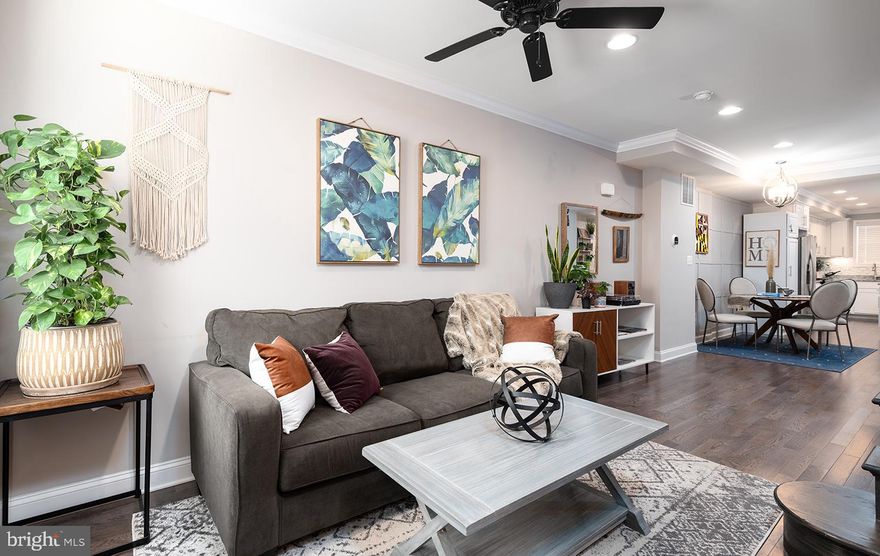 Immaculate 3 bedroom and 3 bath fully renovated home with PARKING and CHAP tax credit (through July 2026). Open and inviting main floor invites you to a cozy living room, leading into the dining room and a gorgeous kitchen, featuring gleaming solid hardwood floors, exposed brick, custom accent wall, and crown molding. Custom designed kitchen with white shaker cabinetry also offers granite countertops, eat-in island, modern backsplash, stainless appliances. Second floor features a master suite with generous closets and a large master bathroom with double vanity, spacious guest bedroom and a hallway bathroom. Interior staircase will take you to the rooftop deck to enjoy the outdoors of the city living.  Finished basement provides another spacious bedroom/den and a full bathroom, perfect for a guest room or an office. Off-street parking pad makes this house a perfect fit, making your city living stress-free.