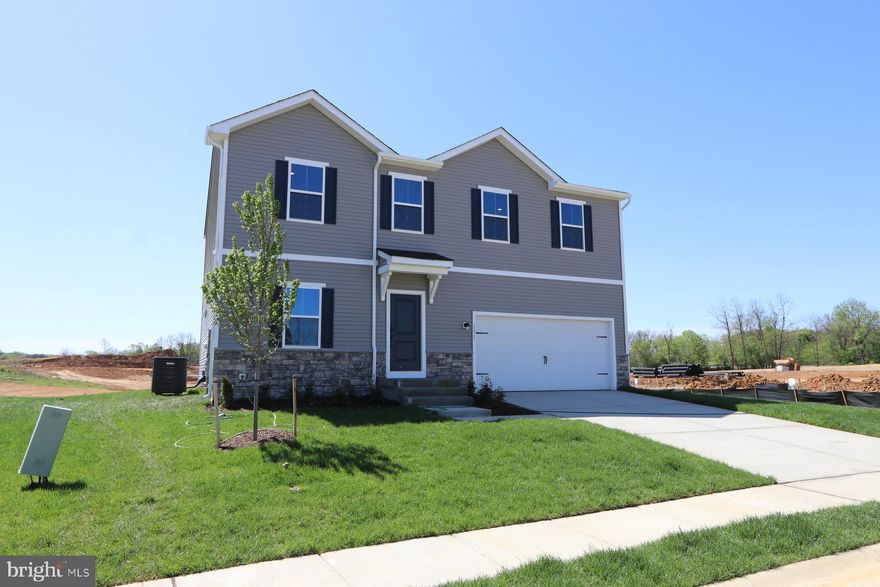 LOOKING FOR A QUICK MOVE IN? READY FOR YOU TODAY! This Water Lily features an open floor plan on the main level with 9 ft ceilings, recessed lighting, large quartz island and countertops, upgraded cabinets, upgraded lighting, stainless appliances, a double pantry, stylishly appointed kitchen, upgraded flooring throughout, 5th Bedroom on main level with full bath and an office! The upper level offers 4 bedrooms, 2 full baths, laundry room and a second Family Room!!The primary suite has 2 huge walk- in closet and a gorgeous private bath with double sinks, upgraded vanity, ceramic flooring and frameless walk-in shower. Unfinished basement with walkout rear exit and rough in plumbing for a full bath. We offer many upgrades to suit everyone! Please call today to set up an appointment to view our decorated. Water Lily Farmhouse model and learn about our amazing incentives we offer!! *Home photos are of a similar Water Lily. *Taxes are an Est. Liberty Run is located in Berkeley Co right on the Jefferson Co line and perfect for commuters to NOVA/DC!