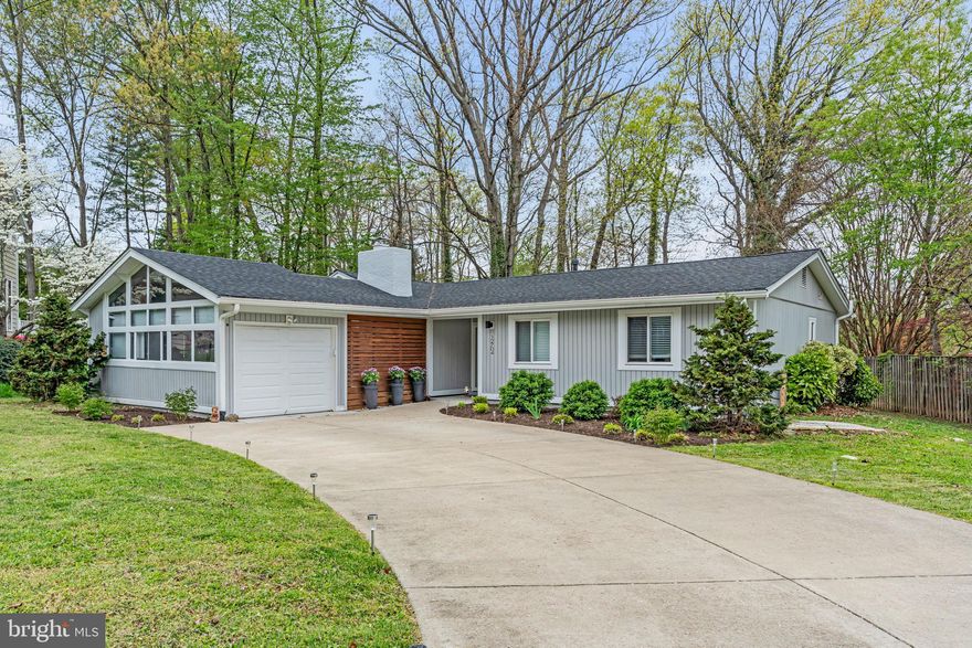 OPEN HOUSE SATURDAY, MAY 10th, 1-4 PM! Please note select images have been virtually staged. Experience refined one-level living in this impeccably renovated Lake Ridge residence. This exquisite 3-bedroom, 2-bath home with a 1-car garage offers a seamless blend of modern design and sophisticated comfort, all with NO HOA. From the custom exterior and professionally landscaped grounds to the stunning chef's kitchen, every detail reflects quality. The culinary haven features chic light grey cabinetry, an expansive quartz island perfect for entertaining, premium stainless steel appliances, and dramatic cathedral ceilings. Enjoy the warmth of the family room's wood-burning fireplace, the convenience of a dedicated home office, and the tranquility of the master suite with a luxurious full bath and walk-in closet. The substantial breezeway provides exceptional outdoor living space. Recent enhancements include a new architectural shingle roof and elegant new luxury vinyl plank flooring throughout (2025), complemented by a generous concrete driveway. Situated in an enviable Lake Ridge location, enjoy effortless access to Quantico, Potomac Mills, Stonebridge, major commuter routes, and a wealth of recreational amenities.