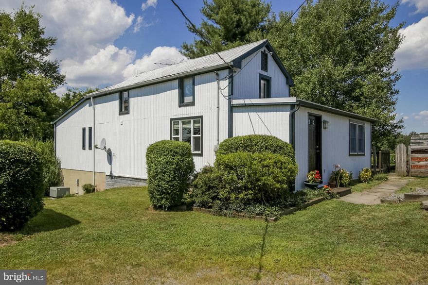 Wow! Just delightful! You will love this 3 bedroom, 2 bath home on almost two acres!  Horses possible, Just across from poplar ford park with horse trails.  Please look for Century 21 directional sign follow down gravel driveway to home.  $50 per applicant processing fee. Privacy and nature abounds! Don't miss this wonderful home!