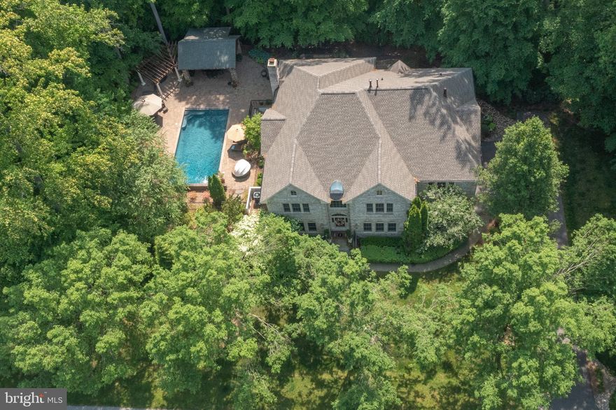 This exquisite home will captivate you both inside and out!  Truly a must-see home!  The amazing outdoor Pool and living space are beyond words including the teak & stone kitchen, 3000+ sf of patio, epi decking, rod iron fencing, uplighting, downlighting, cedar privacy fence, outdoor sprinkler system,  invisible dog fence & more! NEW Architectural Roof and gutters! Enjoy the summer in your black bottom, salt water pool with waterfalls and electric pool cover!  HVAC System just for the pool to heat & cool as you wish! Over $250k alone in pool and decking area! The finished lower level is top of the line boasting over $500k in upgrades to include a theater room, professional style gym, 5th BR/office, gorgeous quartz bathroom, gorgeous kitchen, custom bar area, solid core, and mahogany doors,  contemporary fireplace, and large recreational area! Direct access to the pool from both the main and lower level makes this home perfect for entertaining!  Don't miss the outside bathroom and extra storage!  Backs to gorgeous horse farm!  Very private setting!  South River Colony features include a community pool, tennis courts, basketball courts, community swim team, large tot lot, walking and biking trails and beautiful golf course and clubhouse w/membership fee.