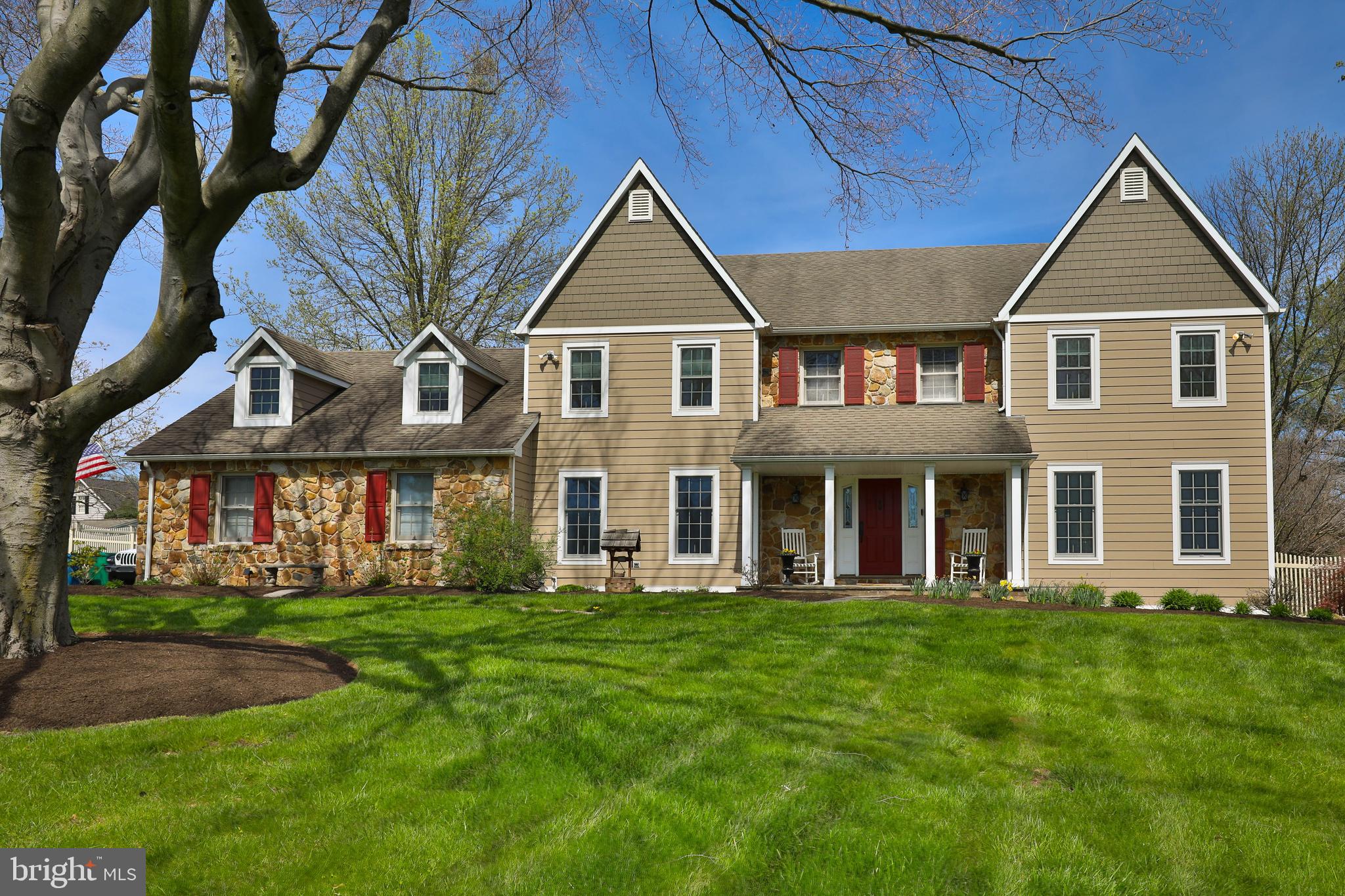 If you're seeking a quiet neighborhood with custom-built homes on large lots in a top-ranked school district, look no further. This Forest Hill colonial home has been refreshed and is waiting for new owners to enjoy its expansive rear yard with an amazing heated, SALTWATER pool this summer. Nestled on an acre of land, this home boasts over 5500 SQ FT of living space. The exterior features beautiful fieldstone with maintenance-free Hardie plank siding, showcasing lush landscaping and hardscaping. The highlight is the serene backyard hosting an 18 x 42 in-ground, heated, saltwater pool and spa with a waterfall, outdoor fireplace, and ample space for a bocce ball court or putting green. Step inside to discover the equally captivating interior. The sunken living room and formal dining room flank the dramatic two-story foyer with a curved staircase. The renovated, light-filled kitchen is a chef's delight, featuring crisp white cabinets, leathered granite counters, a marble-topped center island, and high-end Viking appliances. Don't miss the charming workspace hidden behind a distressed, rolling barn door. The sunken family room offers a wood-burning fireplace with rustic wood ceiling beams. A highlight is the 4-season enclosed porch with flagstone flooring, leading to the amazing rear yard. For your furry friends, there's a designated mudroom with a dog grooming station and an enclosed dog run outside.Upstairs, the owner's retreat features hardwood flooring, two walk-in closets, a sitting room with a fireplace, and a luxurious bath with a jetted tub and stall shower. Three additional uniquely configured bedrooms share an updated hall bath. The finished basement provides 1200 SQ FT of living space, including a bonus "bedroom" and full bath—ideal for hosting guests. Other features include an oversized three-car garage with access to the fenced rear yard. Located near highways, regional rail, parks, trails, and convenient shopping, and within the top-ranked Wissahickon School District, this home is a 10/10 in any market.
