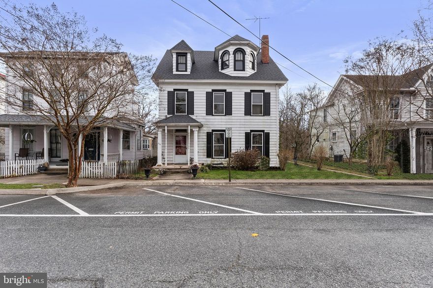 316 Bohemia is located in the Historic District of Chesapeake City in the heart town on the C & D Canal, which is the only working commercial canal in Maryland. These antique homes are zoned village commercial, allowing for residential or business use or a combination of both.  This five-bedroom, three full-bathroom, 3,500-square-foot Victorian home has many lovely historic features still intact.  Original hardwood flooring, two fireplaces with original period tile, mahogany wood surrounds with cast iron summer fireplace covers.  Many cast-iron wall and floor registers.  Solid baseboard wood trim, crown moldings, and the original elegant wood staircase.  Off the second sitting room is the formal dining room that leads you to the main full bath, basement access, and the kitchen. Off the kitchen is an enclosed porch with a door leading back to the second sitting room and a side door leading outside. There are original servant stairs from the kitchen that lead upstairs. The main stairs take you to the large landing of the second floor, where you will find the large primary bedroom with abundant natural light and remarkable bridge views. Down the hallway, you will find two additional bedrooms, a dedicated laundry room, and another full bath with a claw-foot soaking tub.  Heading upstairs to level three is the finished attic space with a two-bedroom apartment, a kitchenette space, and a full bath with a claw-foot soaking tub.  The homes along this side of Bohemia have an alley along the rear with parking and a rear entrance allowing for additional private parking. This home has a large yard that backs to a tidal creek and a short walk to Ferry Slip Park.  The roof was replaced in 2022, and the chimney stack that services the furnace still needs to be repointed.  The furnace was replaced in 2019 and is forced air with oil fuel.  The original well is still present under the enclosed kitchen porch.  This home is ripe for a full remodel to bring this queen back to her glory. Property is being sold as-is. Any inspections will be for informational purposes only. Seller will not make any repairs.