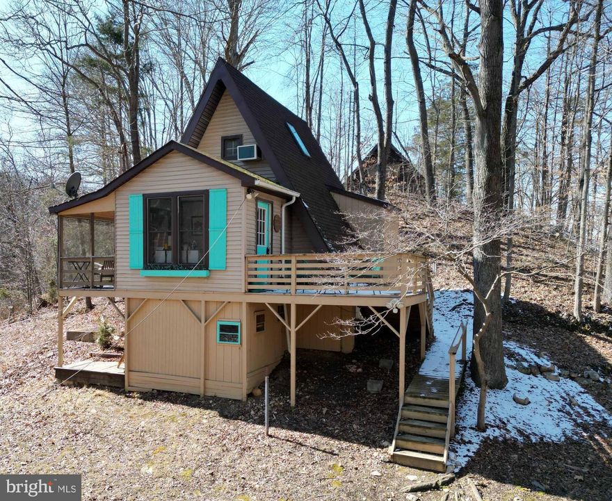 Escape to your own private retreat at this stunning,  renovated cabin, nestled on a serene 1-acre lot in the heart of Shenandoah. Meticulously updated from top to bottom in 2020, this property offers modern comforts wrapped in rustic charm. Most everything inside is new—from the gleaming hardwood floors to the stylish fixtures—and it doesn’t stop there. Enjoy the fresh mountain air from your screened-in porch, bask in the sun on the spacious deck, or unwind under the stars in your very own outdoor biergarten—perfect for hosting friends or simply relaxing in nature’s embrace.

For outdoor enthusiasts, this property is a dream come true! You'll have private access to 200 feet of waterfront along the iconic South Fork of the Shenandoah River, perfect for fishing, kayaking, and tubing. The community also boasts a 400-acre private wooded reserve, ideal for hunting and hiking right in your backyard. Plus, short-term rentals are allowed, making this a fantastic investment opportunity.

Located just minutes from parks and attractions, and a plethora of food and beverage establishments,  this cabin is perfectly positioned for endless adventures. Already a highly successful Airbnb with proven financials (available upon request), this property offers the option to purchase an adjacent Airbnb also for sale by the same owner—perfect for expanding your rental portfolio. See agent remarks about furniture. 

Whether you’re looking for a personal getaway, an income-generating property, or both, 160 Piney Knoll Pl is a rare gem that blends luxury, adventure, and tranquility in one unbeatable package.
Seller Financing is available with terms agreeable to all parties. 

*All information provided is deemed reliable but is not guaranteed and should be independently verified. Measurements, square footage, and other property details are approximate and should be verified by the buyer or buyer's agent. No warranties or representations, express or implied, are made as to the accuracy of the information contained herein.