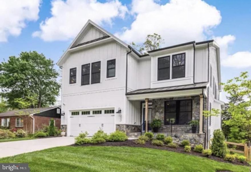 Nestled within the charming confines of Vienna, Virginia, stands a bespoke marvel of modern living crafted by Capital Custom Homes. With outstanding attention to detail, quality craftsmanship, and premium materials throughout, this custom farmhouse epitomizes modern living at its finest. This sprawling 5000 square foot home epitomizes luxury, comfort, and convenience, boasting six bedrooms and 5.5 baths across three meticulously designed levels.

Upon entry, the open main floor plan welcomes guests with its airy ambiance and soaring 10' ceilings. The heart of the home is a designer kitchen adorned with Monogram appliances, complemented by custom cabinetry extending to the ceiling. An expansive 2-inch Quartz island serves as a focal point, offering ample space for culinary creations and casual gatherings. Custom light fixtures, an oversized farm sink, and herringbone tile backsplash grace the kitchen, accentuating its elegance, while a generous walk-in pantry caters to every storage need. The expansive dining room is adorned with picture height board and batten, adding a touch of sophistication.

The main level unfolds seamlessly, revealing an oversized family room adorned with a beamed ceiling and a striking brick floor-to-ceiling fireplace, perfect for cozy evenings and intimate conversations. A mudroom and home office enhance functionality and organization, while French doors beckon towards the Trex deck, blurring the lines between indoor and outdoor living.

Ascending the stairs, four en-suite bedrooms await, each a sanctuary of comfort and style. A spacious laundry room simplifies chores, while a second home office/flex space provides versatility for modern lifestyles. The primary bedroom exudes opulence, featuring a wall of shiplap, his and her walk-in custom closets, and a luxurious en-suite bathroom adorned with dual vanities, a soaking tub, spa shower, and heated floors.

Descend to the fully finished lower level, where an additional bedroom and full bath offer privacy and convenience for guests or family members. A flexible space that is currently used as a gym can easily be transformed into a 6th bedroom, office or entertainment area, while a large recreation room beckons for leisurely pursuits. The entertainer's wet bar, resplendent with quartz countertops and marble backsplash, sets the stage for memorable gatherings and soirées.

Outside, a spacious flat fenced backyard beckons, offering ample room for outdoor activities and relaxation. This oasis in the heart of Vienna is within walking distance of Fairfax County's Cunningham Park, featuring recently resurfaced, lighted tennis/pickleball courts, and ball fields, as well as being only half a mile from the W&OD trail, perfect for outdoor enthusiasts. Additionally, residents have easy access to the Vienna Community Center and the Vienna Farmers Market as well as grocery stores, restaurants, and retail, ensuring effortless access to everyday conveniences. The proximity to Tysons Corner, known for its shopping, dining, and business opportunities, adds another layer of ease for residents. Additionally, quick access to Route 66 and 495 ensures effortless commuting to surrounding areas, making this location ideal for those who work or frequently travel throughout the region. It's the perfect blend of luxury living and practicality, offering both the tranquility of suburban life and the convenience of urban amenities.