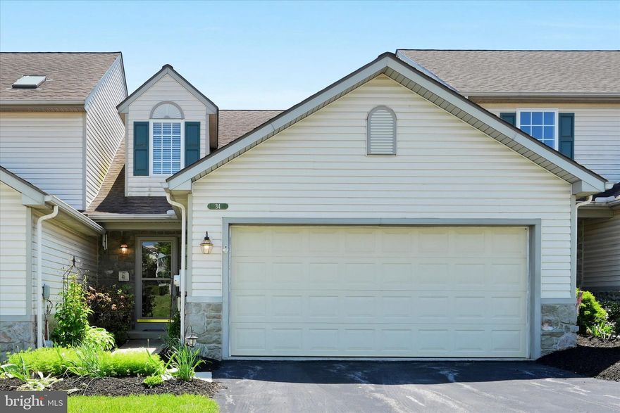 Enjoy the ease of one-story living in the desirable Grandview Meadows community, where sidewalk- and streetlight-lined streets invite evening strolls and a true neighborhood feel. Ideally located, this home offers close proximity to everyday conveniences along with easy highway access for seamless commuting and travel. Inside, two-story living room creates a welcoming first impression, centered around a cozy corner gas fireplace. Custom columns gently define the space while maintaining an open flow into the bright and cheerful kitchen, designed with both everyday living and entertaining in mind. The main level features a spacious primary suite, offering comfort and convenience with a private bath that includes a double vanity, walk-in shower, and supplemental heat for added warmth. This thoughtful layout allows for true first-floor living without sacrificing space. Just off the main living area, a fantastic screened-in porch provides the perfect spot for relaxing mornings or casual outdoor dining, extending your living space into the fresh air. Upstairs, an open staircase leads to a loft filled with natural light from a skylight—an ideal flex space for a reading nook, home office, or lounge area. Two additional bedrooms and a full bath complete the second floor, creating a comfortable and private area for guests or visiting family. The lower level offers excellent potential for future expansion, with a daylight walk-out design ready to be finished into additional living space. In the meantime, it serves well as a play area or clean, dry storage. Additional highlights include natural gas heat and hot water, along with an oversized two-car garage featuring a convenient utility sink.Warm, welcoming, and thoughtfully designed, this home offers comfort, flexibility, and a location that makes everyday living easy.