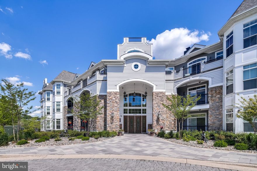 **Back on  market***Just imagine yourself in this ***Outstanding, sophisticated and spacious " Cobblestone model" 2 bedroom 2 full and 1/2 bath bright and cheery condo situated in the newest of  The Bluffs at  Quarry Lakes, buildings.  Gorgeous views of the lake,  make you feel like you are on vacation year round.  Lovely hardwood floors in the living spaces while  neutral  carpet  is in the 2 bedrooms.   Double vanities in master bath as well as a sunken tub and separate shower.   Stainless steel appliances, beautiful 42" wood cabinetry and spacious pantry along with a large eat in area provide for a gourmet cook's dream  kitchen.  This condo provides wonderful living space with a separate den/ office as well as a sunroom/ game space.     2 indoor tandum  parking spaces and separate storage room.  Amenities in this community include outdoor pool, tennis courts, walking path,  exercise room, and meeting/ party room.  With the towne centre  feel, there are  also   business and shopping areas as well as a food market,  Drugstore,  and bank .    Restaurants and an ice cream parlor make for a very special place to call home.  Call listing agent to set up appointments and details.