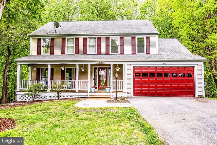 Nestled among the trees is where you will find 10617 Edinburgh Drive. Located just off Courthouse Road, this 4-bedroom, 2.5-bath Colonial is ready and waiting for its new owners.  This home has so much to offer--it hits all the marks! The sweet front porch is the perfect spot to sit and relax and enjoy your favorite beverage after a long day. The layout on the first floor includes a spacious living room, formal dining room with a large window overlooking the back yard, a warm and inviting kitchen with separate breakfast room, and a comfortable family room with plenty of space for guests to gather. There is also a laundry/mudroom off the attached 2 car garage. The second floor features the master bedroom suite with walk-in closet and master bath with large soaking tub, separate shower, and double sinks.  Three other good-sized bedrooms and hall bath finish off the space. The lower level of the home is one large recreation room, which can be arranged to fit your needs. There is also a big storage room that can house all your odds and ends. One of the highlights of the home is the awesome back deck. Surrounded by trees, you will feel like you're in your own treehouse! Just a short drive to Route 1, I-95, the VRE train, shopping, and more, 10617 Edinburgh Drive will make you feel like you're tucked away from the hustle and bustle, yet close to everything the area has to offer. In the Sellers own words:  Why we love the house: We love living in the Edinburgh neighborhood because it s honestly very peaceful, neighbors are sweet, and it s been great raising our family here.  The school district is top notch, Courthouse Road Elementary is amazing, the teachers & admin have been so good to work with.  This house is an entertainers dream.  Plenty of room for our guests. The deck space is gorgeous, very relaxing and fun for our family and friends  This is an easy house to fall in love with!