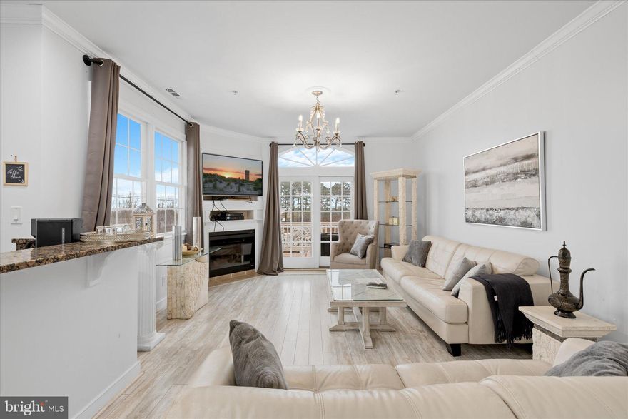 Welcome to coastal living at its finest in this beautifully designed 3-level end-unit townhome featuring 3 bedrooms, 3.5 baths, plus an additional flexible room currently set up as a sleeping area—perfect for a den, home office, media room, or game room. Located in West Ocean City, this home is ideally nestled between the Ocean City Fishing Center and Sunset Marina, offering both convenience and a true waterfront lifestyle.
The top-level living area is designed for entertaining, with an open-concept living, dining, and kitchen space, a cozy fireplace, and direct access to a large east-facing deck—ideal for morning sun and coastal breezes. The kitchen features a breakfast bar and a wet bar with beverage/wine refrigerator, creating an inviting space for gatherings.
This townhome offers three east-facing decks—one on each level, providing multiple outdoor living spaces. Tile and luxury vinyl plank flooring run throughout for easy coastal living. An elevator services all floors, adding convenience and accessibility.
The garage has been partially converted into additional sleeping space, while still offering storage for beach chairs, bikes, and water toys. As an end unit, the home enjoys added privacy and natural light.
Just minutes from popular waterfront dining including Mickey Fins, Harborside, Sello’s, and Sunset Marina, and close to the Ocean City Outlets and Food Lion, this property is perfectly positioned for full-time living, a second home, or an income-producing investment.
Spacious. Versatile. Perfectly located for the coastal lifestyle.