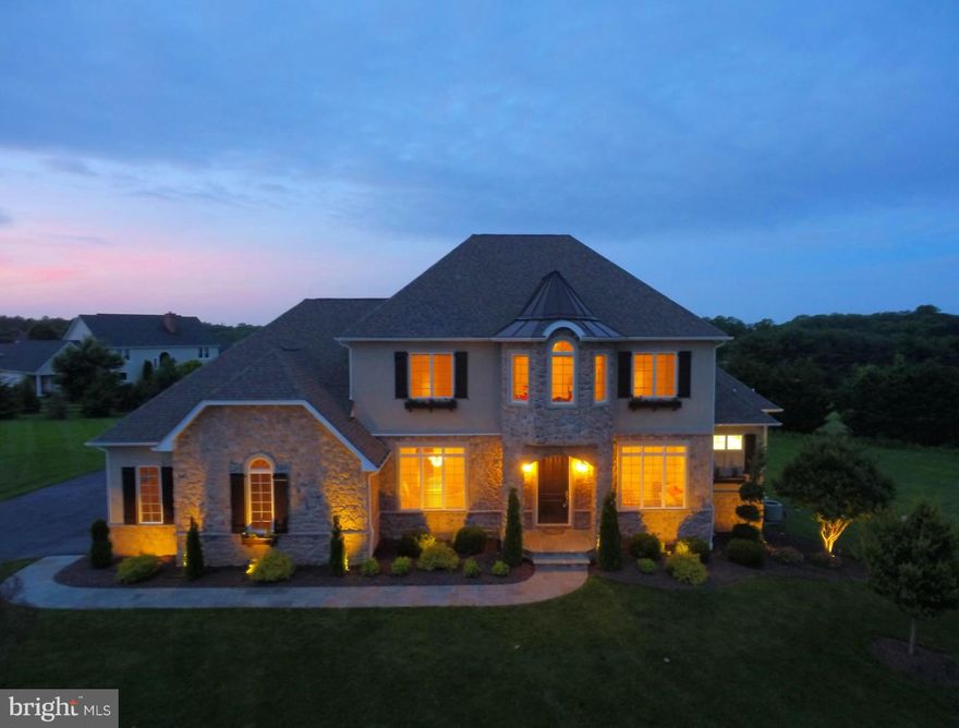 Custom French Country in Briar Knoll. 1st Flr Master Suite w/ lg bath ensuite w/ glass enclosed shower, soaking tub, walk-in closet & walkout access to bluestone patio. Open main level w/ gourmet kitchen to large family room w/ barreled ceiling, stone, gas FP &  french doors to bluestone patio w/ gas FP. Finished LL with In-law suite & entertainment & bar area. New paint, landscaping & updates!