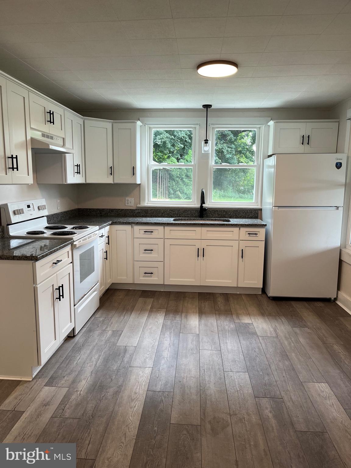 For rent is a first floor 2 bedroom apartment. This unit has a brand new kitchen, brand new full bathroom. Apartment uses oil forced air heat and window units for A/C. There is shared parking in the front of the building. Apartment has laundry hook up on the main floor. No Smoking, No Pets. $50 nonrefundable application fee required per applicant and if selected $50 admin fee. 650 Min. Credit Score Tenant takes care of mowing and flower beds.