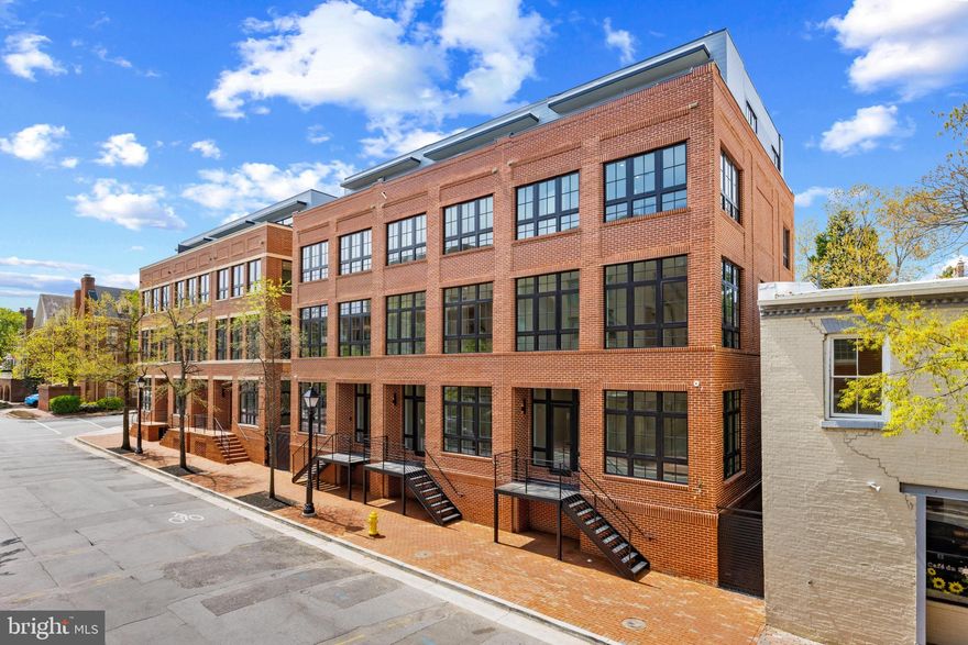 Situated on Old Town Alexandria’s most prestigious street with Potomac River Views, this  River Row Residence 217 South Union Street is one of just six newly constructed, LEED Gold-certified homes redefining luxury living along the Potomac River. Developed by the visionary JC Development, this four-level residence offers a rare fusion of refined design, advanced engineering, and an unbeatable waterfront location—with no HOA or condo fees. Crafted from solid steel and concrete and wrapped in classic brick, the residence spans 3,366 square feet and rises four stories via a private elevator. River views  and architectural integrity is evident throughout—12-foot ceilings, 9-foot solid core doors, 8.5-inch white oak flooring, and expansive Andersen windows create a light-filled, contemporary interior grounded in timeless materials. The main living level features an open-concept layout flowing to a 440-square-foot outdoor terrace finished in imported Spanish porcelain tile—ideal for entertaining or alfresco dining. The gourmet kitchen is appointed with soft-close American Woodmark cabinetry, Taj Mahal quartzite countertops, and a professional-grade appliance suite: Thermador 36-inch gas range, double electric wall ovens, Bosch French-door refrigerator, Thermador dishwasher, and Sharp microwave drawer. Every detail is designed for elevated daily living and seamless entertaining. Four spacious bedrooms—each with ensuite marble-clad baths and Kohler fixtures—offer comfort and privacy. The top level opens to a 189-square-foot rooftop terrace with city and river views in select homes, enhanced by a fourth-level wet bar featuring Taj Mahal quartzite counters and a Summit beverage refrigerator. LEED Gold certification reflects the residence’s commitment to sustainability and efficiency. High-performance systems include recessed LED lighting, 2-zone Goodman HVAC with Ecobee smart thermostats, electronic air filtration, humidifiers, a Rinnai tankless water heater, and a full home sprinkler system—resulting in lower utility costs and superior indoor air quality. Additional highlights include an 800 lb-capacity private elevator, integrated surround sound, Akuvox smart doorbell, multiple laundry hookups, and a lower-level family room with a second wet bar, Taj Mahal quartzite counter, and dual-zone Newair beverage refrigerator—ideal for casual gatherings or movie nights. The oversized two-car garage (21’ x 20’) includes a low-profile door for enhanced headroom and a Kwikset keypad entry for added convenience. Each residence comes with a California Closets credit for customized wardrobe systems. This is a rare opportunity to own newly built luxury on one of Old Town’s most iconic blocks—just one block from King Street and steps from the Potomac River and waterfront promenade. With over 20 dining options within three blocks, four parks within six, and proximity to Lyles-Crouch Elementary School, River Row supports an effortless, enriched lifestyle.
Commuters enjoy quick access to Reagan National Airport (3.7 miles), King Street Metro and Amtrak/VRE Station (1 mile), and key routes to Washington, D.C. and National Landing. Developed by JC Development—an esteemed firm with 25+ distinguished projects across the region—River Row is a testament to modern luxury grounded in Alexandria’s historic charm. Residence 217 is more than a home—it’s a landmark of thoughtful design, sustainable living, and timeless elegance.