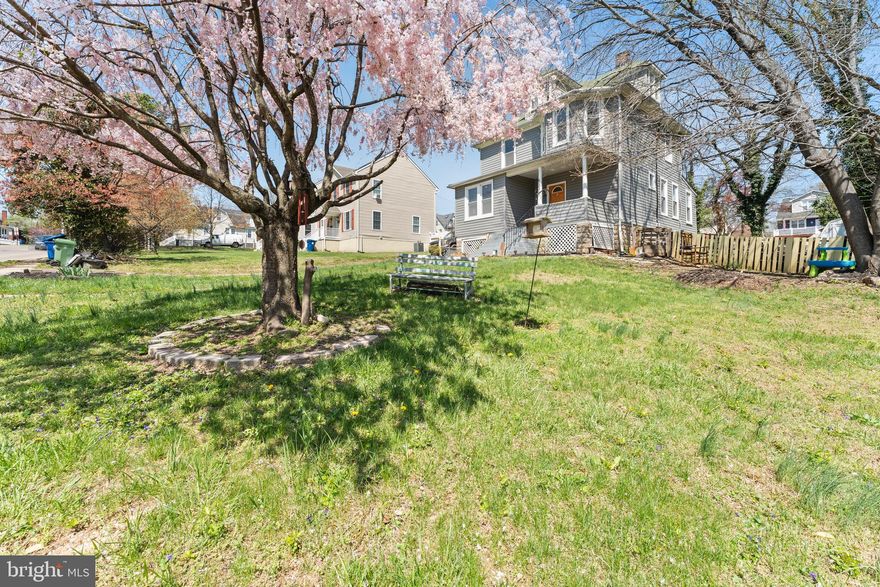 Welcome to 4004 Fleetwood Avenue — a spacious and versatile home in the heart of Baltimore, thoughtfully designed with room to grow and spaces that adapt to your lifestyle!  Step up to the inviting covered front porch with newly installed outdoor carpet, and into a bright foyer that leads into a large living room with a convenient half bath, complete with a new vanity and fresh paint — perfect for both everyday living and guests.  Flow into the open dining and kitchen area, where the kitchen boasts brand-new flooring and overlooks the dining space. A rear door leads to the flat backyard, ideal for outdoor entertaining and everyday convenience. Outside, you'll also find a bonus one-car garage and a backyard shed — perfect for storage or workshop space.  The unfinished basement offers excellent storage and houses the home’s major systems, including a new sump pump installed in 2024.  Upstairs, you'll find a full hall bathroom, a primary suite with its own private full bath, and two additional bedrooms — one of which includes a walk-through to the finished third level. The top floor is currently used as a fourth bedroom and features a mini split system and its own full bath, making it a great option for guests, a private retreat, or flex space.  Recent updates in 2023 include new laminate flooring on the first floor, new carpet throughout the entire home, new siding around the entire exterior, and roof repairs.  Additional updates include a new sump pump (2024), new kitchen flooring, new vanity in half bath, new outdoor carpet on the front porch, and fresh paint throughout (2025).  The long driveway offers off-street parking for 6+ vehicles, a rare city bonus!  This home offers space, functionality, and updates already in place — schedule your private tour today!