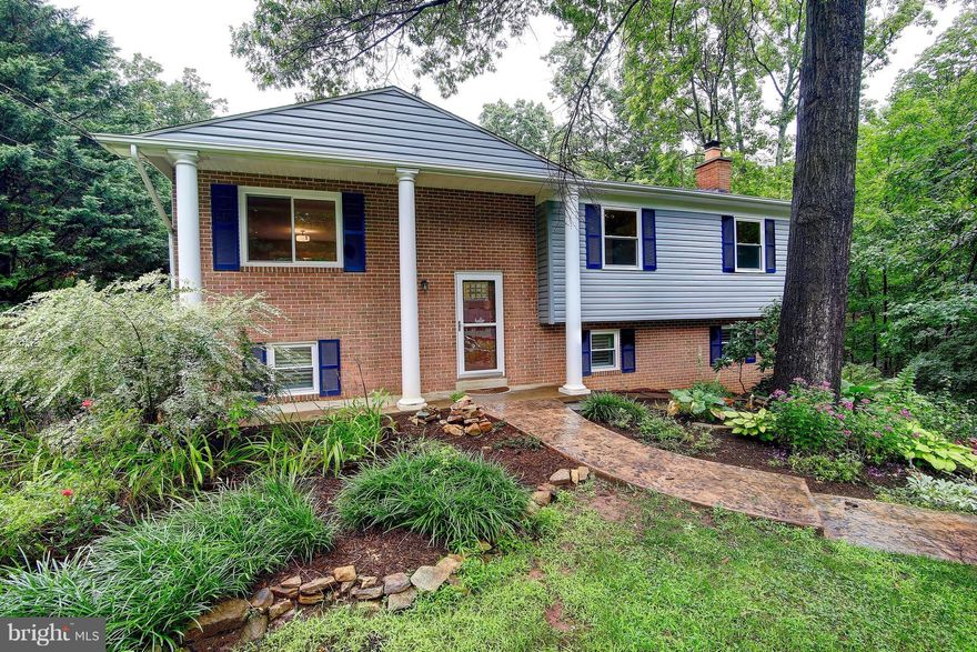 MOVE IN READY!  Quick delivery home has been updated top to bottom! Kitchen has new appliances & open concept ! Walk out to a huge deck,!!   3.5 baths, Lower family room with fireplace plus recreation room, , 4th bedroom, utility room and full bath  !*Gorgeous backs to woods This is a must see !! It wont last long ! Welcome Home !! Fenced rear yard !