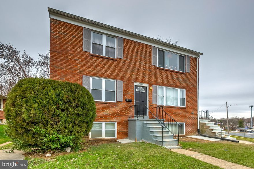 Terrific layout with plenty of living space. Main level apartment features 2 bedrooms, 1 full bath, W/D in unit. Parking pad and shared back yard. Easy access to the 695. This won't last long!