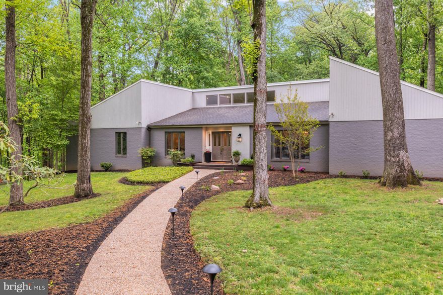 Prepare to be wowed: This custom contemporary home offers one of the most beautiful multigenerational setups you’ll ever find, complete with a jaw-dropping, fully separate in-law suite on the lower level with its own private entrance.

This lot and location are a true 10/10, featuring a heated in-ground pool, exceptional privacy, and 3.6 acres in the sought-after Bearman neighborhood.

The sprawling 4,000+ square foot main level features a stunning great room with a stacked stone fireplace & vaulted ceiling, spacious kitchen and dining area, dedicated office, formal living and dining rooms, four bedrooms, and 4.5 baths. The primary suite is a true retreat with a large sitting area, massive walk-in closet, and private sauna. An additional en-suite bedroom, two more bedrooms, and updated baths complete the main floor.

The finished lower level is an absolute showstopper. The custom-built in-law suite offers its own gorgeous kitchen, dining, and living spaces, 2 bedrooms (plus a third potential bedroom/office), 2 full baths, and a private entrance - it's the ultimate luxury setup for extended family or guests.

The outdoor living areas are just as impressive, with a heated in-ground pool, expansive deck, fenced backyard, playground, fire pit area, and endless space to spread out and enjoy.

The owners have meticulously maintained this home, completing a major refresh before listing with fresh paint, new carpeting, and refinished hardwoods. Recent updates include new sliders and French doors, two of three water heaters, two of four HVAC zones replaced, and more.

A rare opportunity for luxury, multi-generational living, and privacy in an unbeatable location!