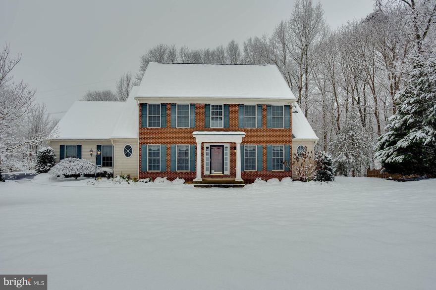 Beautiful Colonial with 1st Floor Master Suite Nearly 3000 Finished Square Feet plus Unfinished Walk-Out Basement Features Include Hardwood Floors Detailed Molding Through out  Gourmet Kitchen with Granite Counters and Stainless Appliances Light Filled Breakfast Area with Bay Window 2 Story Family Room with Gas Fireplace Master Suite on Main Level with Huge Walk-in Closet and Renovated Luxury Bathroom Upper Level Includes Princess Suite and 2 other bedrooms with Buddy Bath , Loft Overlooking Family room & Craft Room.  Fixed stairway to Floored Attic   Deck overlooks Private 1 acre Back yard.