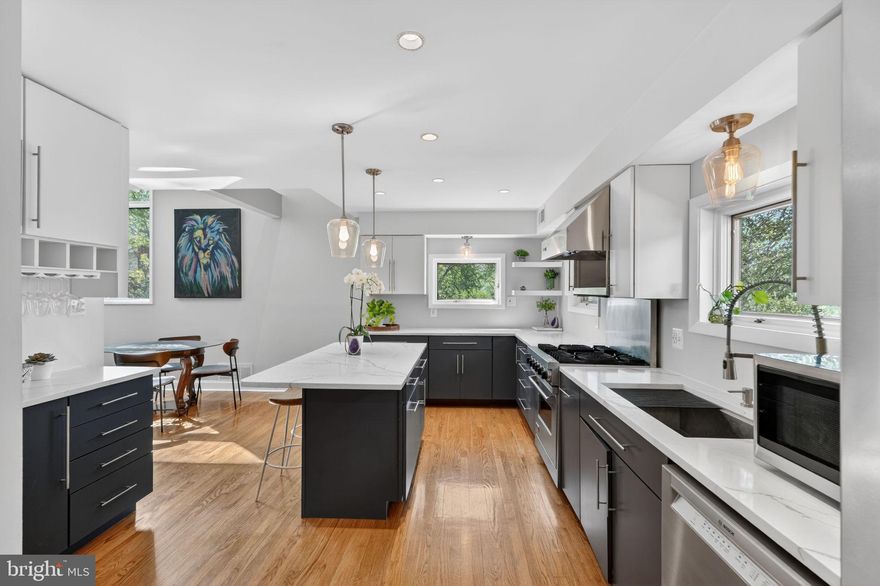 Welcome to 12500 Arrow Park Drive, a striking mid-century modern residence that seamlessly blends timeless architecture with thoughtful updates, nestled in the highly desirable Tantallon community. This one-of-a-kind home offers 4 bedrooms and 3.5 bathrooms, defined by clean lines, expansive windows, and light-filled living spaces throughout.

The open-concept main level features original hardwood floors, a spacious living room with a fireplace, and effortless flow between the living, dining, and kitchen areas—ideal for both everyday living and entertaining. A versatile main-level bedroom or home office, paired with a full bath, provides flexibility for guests or remote work. The beautifully updated kitchen is both stylish and functional, showcasing granite countertops and premium stainless steel appliances, including a Viking range and Bosch dishwasher.

Upstairs, a lofted studio with track lighting overlooks the main living area, adding architectural interest and flexible living space. The upper level also includes three bedrooms, highlighted by a private owner’s suite with an en suite bath. Additional features include updated James Hardie siding, custom stained-glass accents, new window framing, and a side-entry two-car garage complete with a workshop and ample storage.

Ideally located just minutes from National Harbor, Tanger Outlets, Andrews & Bolling Air Force Bases, and major commuter routes including I-295, this home offers a rare combination of architectural character, modern comfort, and everyday convenience.