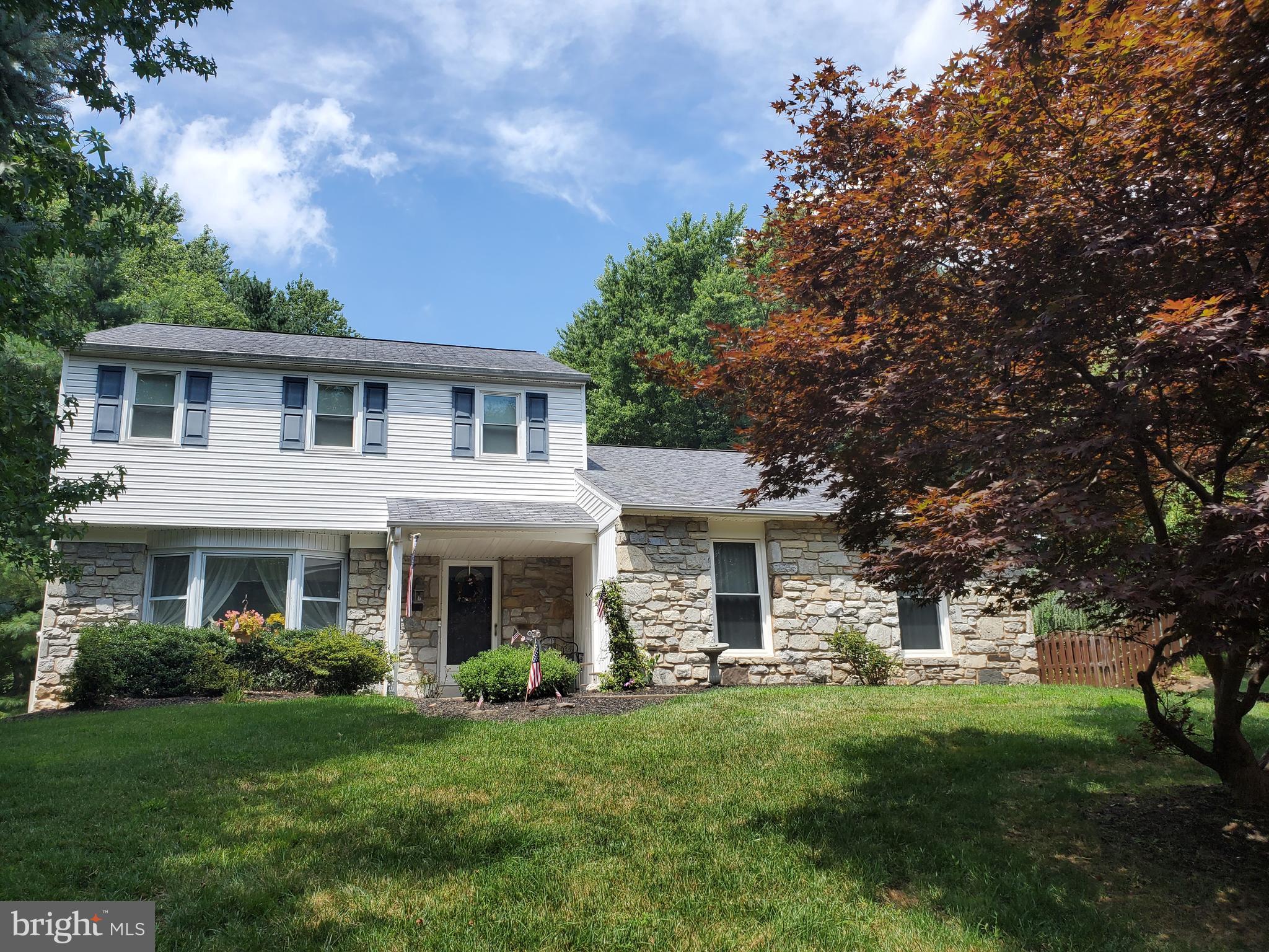 Welcome to 81 Dawn Dr, in the highly sought Pheasant Run neighborhood within Council Rock School District. This stately home welcomes you from a covered entry to a center hall entry, where the gleaming hardwood floors will immediately grab your attention. They continue through the light-filled sitting room and the large dining room.  The spacious eat-in kitchen has neutral tiled floor and backsplash, granite countertops and matching stainless steel appliance suite.  This room overlooks the sunken livingroom for a cozy flow and seamless entertaining.  Beautiful built-in shelves and whitewashed brick fireplace crown this room. There is a door to the sprawling rear yard and paver patio. Also off this room is a powder room, access to the 2-car garage, and a laundry /  mud room with a door to the driveway.  Talk about a great first floor layout! On the 2nd floor you have a recently updated full hall bath with tub and shower, 2 generous bedrooms with ample closet space, and the master bedroom with  en-suite bathroom with shower.  This home also has a basement level with plenty of room for the mechanicals, storage, and your imagination.  Finished rec room? Home gym? work-from-home quiet room? Your choice! 81 Dawn will suit all your needs. Welcome Home!