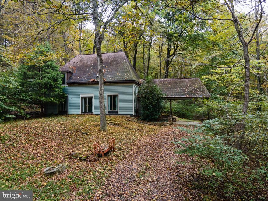 Welcome Home to 1234 Cacapon Rd! Enjoy your own wooded wonderland - 24 Acres of Unrestricted land located in the mountains.  Built with the passion of woodworking, this French Provincial inspired style home was built and lived in by the owners. It features 3 bedrooms - one on the main level. Two full bathrooms - one located on each level.  Open concept living with tile flooring, and a white cast iron wood stove.  A carport with wrap around entry.  A large oversized wood workshop - much of which will convey with the home. Don't hesitate to make this unique property yours!