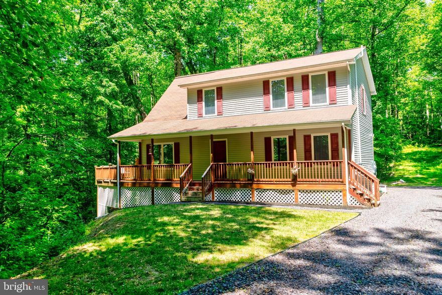 Tucked neatly out of sight, this home embodies privacy and serenity! Incredible wraparound country front porch/deck connects with a large side deck for exceptional outdoor entertaining. Ease of entertaining continues inside with a modern open floor plan that is culminated by the beautiful loft area.  Speaking of the loft area, the entire home is flooded with natural light, and this is especially true of the loft. The loft would  make a great office area, among many other potential uses. Spacious bedrooms, unique upgraded jetted tub in the master suite, built in bar area in the kitchen/dining area, and much more -----Full unfinished walkout basement holds a lot of potential for increasing the finished square footage of the home.  -----  If you love privacy and seclusion in nature, this is the home for you!  Come see it today!