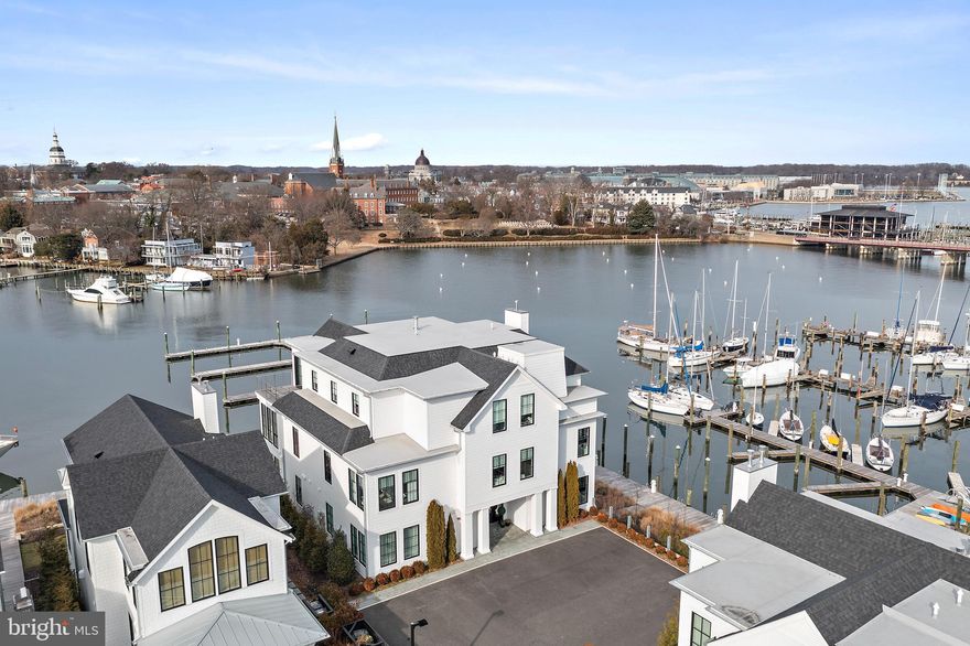 South Annapolis Yacht Center is located on Spa Creek overlooking the beautiful skyline of Historic Annapolis. This award winning residence features an elegant interior design that brings the feel of the adjoining waterway into the living area. Patrick Sutton thoughtfully did the interior design and Bret Anderson of Pyramid Builders constructed this magical 3 bedroom, 3 bath waterfront residence. A bright open floor plan, perfect for entertaining, connects to the wrap around deck overlooking the water.  The kitchen features a six burner La Cornue range with matching hood, Sub-Zero refrigerator with custom freezer draws, wine cooler and a large luxe marble center island all overlooking the water. The Primary Suite enjoys beautiful views of Spa Creek & Annapolis, a large dressing room with rosewood cabinets and a luxurious spa like bath. The Primary suite walls are fully upholstered with a wool herringbone material and braided leather trim giving the space a warm comfortable feel. There are 2 additional ensuite bedrooms with one doubling as a den/in home office. There are 2 gas fireplaces, one in the main living area and one on the waterfront deck. There is a rented 1 car garage (across the street, $700/mo) and a storage unit in the lower level of the building. Access to this fabulous residence is via an elevator that opens directly into the unit. Enjoy watching the Christmas Boat Parade, Commissioning Week Blue Angels Show and the 4th of July Fireworks from the waterfront deck. The adjoining world class marina not only is a perfect spot to keep your boat but a great view to watch some of the most beautiful yachts on the East Coast. The prime Spa Creek location, the quality of construction and the award winning interior design puts this property in a league of its own. CHECK OUT THE 3D FLOOR PLAN.