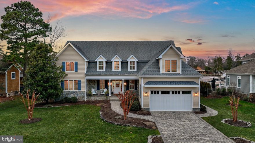 Welcome to 109 Blackpool Road, a beautiful home nestled in the coveted Rehoboth Beach Yacht and Country Club community!  Blending the perfect balance of comfort and coastal elegance, this 4,350+ sq. ft, 5 bedroom, 4.5 bath property was thoughtfully crafted to take full advantage of spectacular water views at every turn.  Situated on the peaceful Bald Eagle Lagoon, curb appeal abounds with a handsome paver driveway, mature landscaping, shaker style siding, and a welcoming covered front porch.  The backyard oasis is truly captivating!  Imagine navigating your boat up to your private pier complete with a Pontoon lift, PWC lift, and a floating dock to accommodate two personal watercraft.  This charming home has many seller add-ons including the beautiful wrap-around composite deck adorned with modern cable railings, a protective overhang for shade, and a quaint paver patio with a firepit.  The new black rod iron fence offers both an aesthetic appeal but also a safe space for furry friends.  With easy access to Rehoboth Bay this location offers an idyllic setting for boating trips, kayaking, and crabbing, and fun filled summer days on the water are just ahead!   Inside this exceptional home you will find two levels of robust living space highlighted by beautiful hardwood floors, shiplap millwork, plantation shutters, new stylish lighting fixtures, and a pleasing color palette that carries throughout.  The open concept layout unfolds providing endless entertainment opportunities between the kitchen, dining areas, living room and two-story great room complete with a cozy gas fireplace The bright and airy interior is enhanced by expansive windows and glass sliding doors allowing natural light to fill the living space.  If you enjoy cooking you will love the spacious gourmet kitchen featuring a 6-burner gas range with a new range hood, high-end stainless steel GE Profile appliances, two ovens and a built-in microwave, a deep walk-in pantry, plenty of counter space, 42” updated white cabinetry with pull-out shelving, sleek granite counters, a stylish backsplash, and a convenient breakfast bar.  Just off the kitchen is a spacious laundry center with storage cabinets and sink, and a powder bath.   Sleeping quarters start on the main level with a waterfront primary bedroom providing a private retreat with access to the wrap-around deck, two walk-in closets, a spacious updated luxury bath with a stall shower, soaking tub, two separate vanities and a private water closet.  Travel upstairs to 1900 additional sq. feet  of living space encompassing four graciously sized bedrooms. Two of the guest suites have ensuites and feature private decks with waterfront vistas.   Additional upgrades to this meticulously maintained home include a new irrigation system, extensive exterior landscape lighting, new roofing and gutters on the back deck area, a concrete slab added to the crawl space, and new dock boards.  This home is also equipped with electronic smart door locks, a smart thermostat, Ring doorbell, security system and surround sound.   Being a resident of the Rehoboth Beach Yacht and Country Club affords you easy access to Route 1 and is central to shopping, dining, entertainment venues and just minutes from downtown Rehoboth and Dewey Beach.  Come, see, and explore all that this beautiful home has to offer and start making some special memories of your own! Remember, living on the water is not just a location, but a Lifestyle!!!