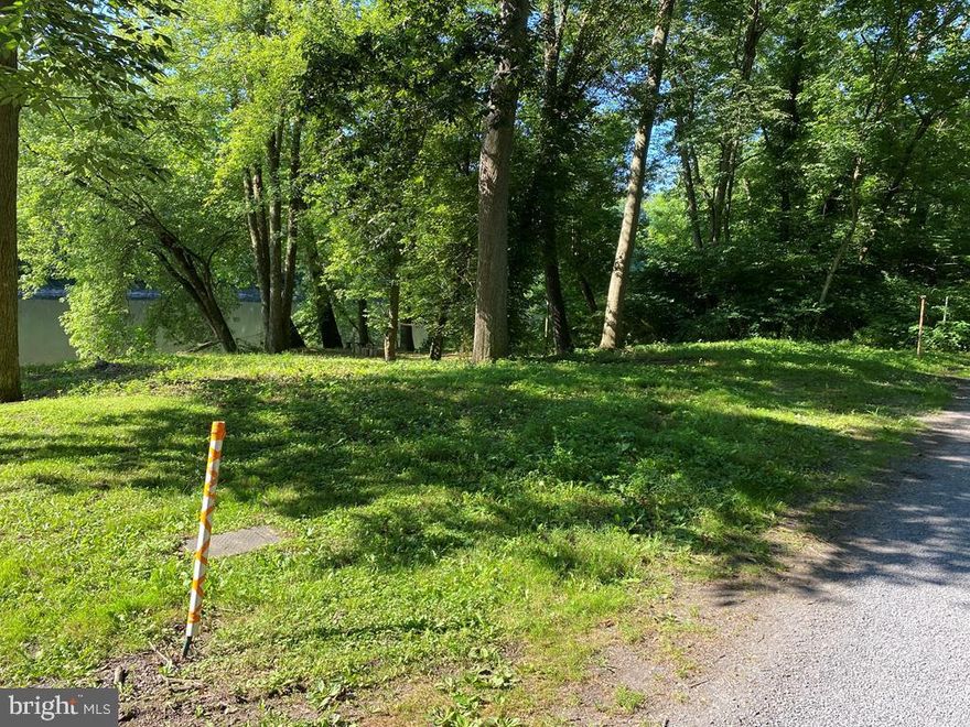 Juniata River Lot for Sale just past McVeytown in Wayne Township, approx. 65' X 65', lot corners are marked with white/orange stakes, Electric line under metal plate on lot,  $100 yearly association fee maintains roadway to your lot, new steps down to water are needed, firepit included.