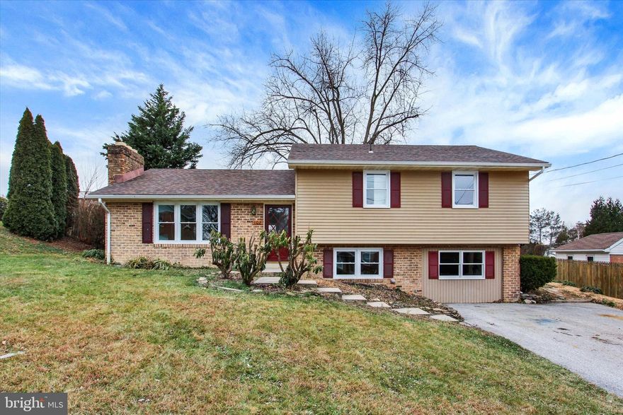 Freshly updated, move-in ready, and immediate occupancy available! This delightful 3-4bedroom, 2-bath split-level home offers modern upgrades, comfortable living spaces, and a convenient Hanover location. Enjoy off-street parking and a lovely backyard perfect for relaxing or entertaining. Step inside to a living room with a wood-burning fireplace with woodstove insert. You'll also find fresh paint throughout, along with new carpeting, laminate plank flooring, and a new granite kitchen with stainless steel appliances. A slider leads to a patio overlooking the yard. Most windows have been replaced, bringing in great natural light, and the brand-new roof offers peace of mind for years to come. A primary suite has a full bath and walk-in closet. The lower level is mostly finished with a family room and a bonus room you could use as a 4th bedroom or any other space you might need. A standout feature is the tankless water heater—so sleek it looks like a piece of art. The laundry room is also located on this floor.  Ideally situated just around the corner from Campbells, Snyders, and Hanover Foods, you’re also within walking distance to Rutters and Brothers Pizza. A great home in a great spot—don’t miss this one!  AGENTS - Please read Agent Remarks.