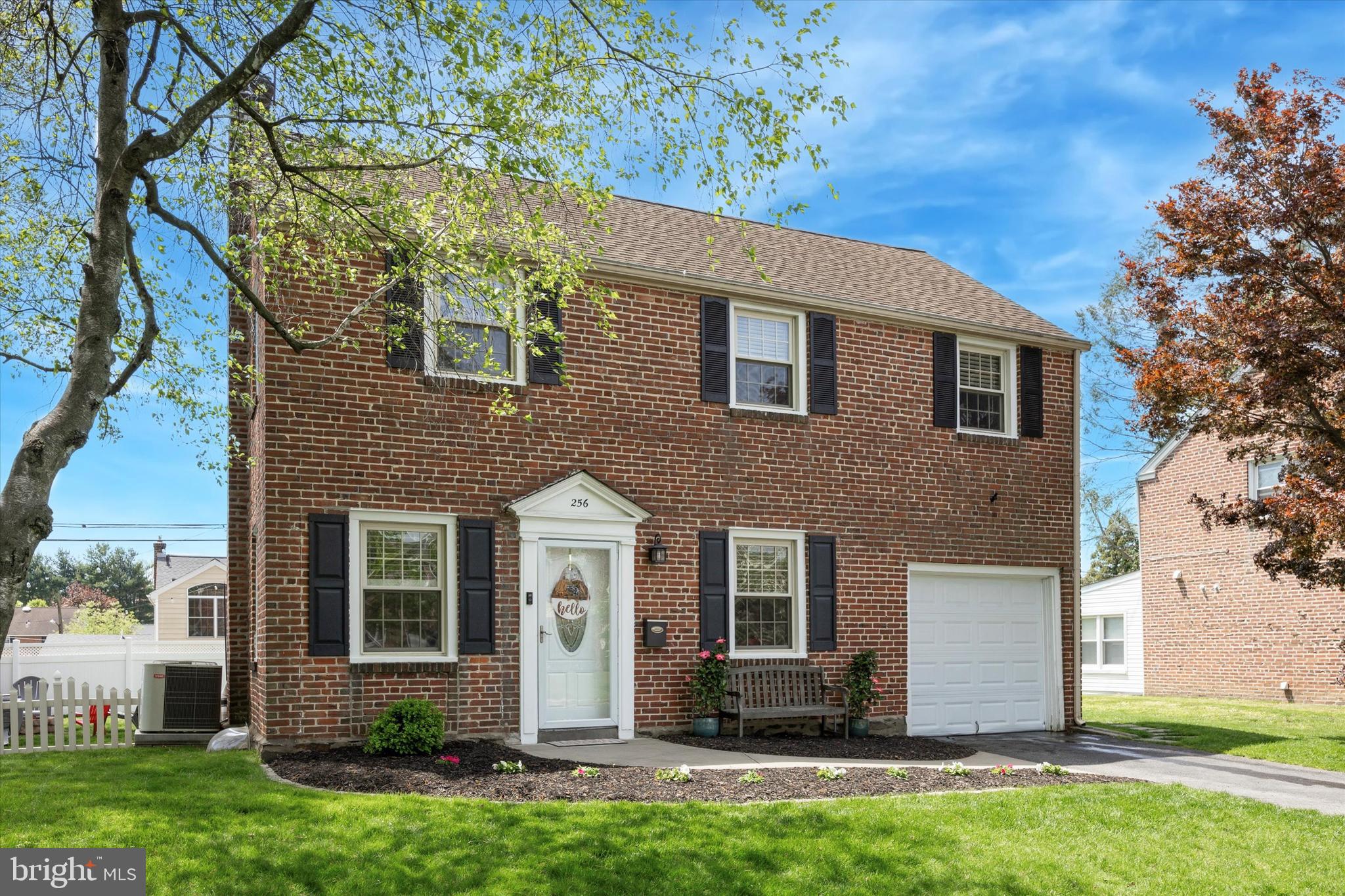 Welcome to 256 Ridgewood Rd, a beautifully maintained brick colonial nestled in the highly sought-after Springfield neighborhood. Ideally located within walking distance to Saxer Ave's dining and shopping, parks, and top-rated schools, this home strikes the perfect balance of convenience and community. Boasting 3 bedrooms and 1.5 bathrooms, this charming home features hardwood flooring which carries throughout. The open-concept kitchen offers stainless steel appliances, granite countertops, subway tile backsplash, two-tiered peninsula island w seating for 2, and rear access to a concrete patio — perfect for when entertaining. Upstairs, the primary is complemented by two additional generously sized bedrooms and a full hall bath, offering plenty of space for a growing family or guests. The finished basement provides even more flexibility with a half bath, laundry area, and ample room for a home office, playroom, or media room. Outside, the expansive backyard is designed with entertaining in mind, complete with a patio, fire pit and ample space for everyone to enjoy. Additional features include: an attached garage, brand-new HVAC (2025), a fenced-in backyard, and a radon mitigation system.