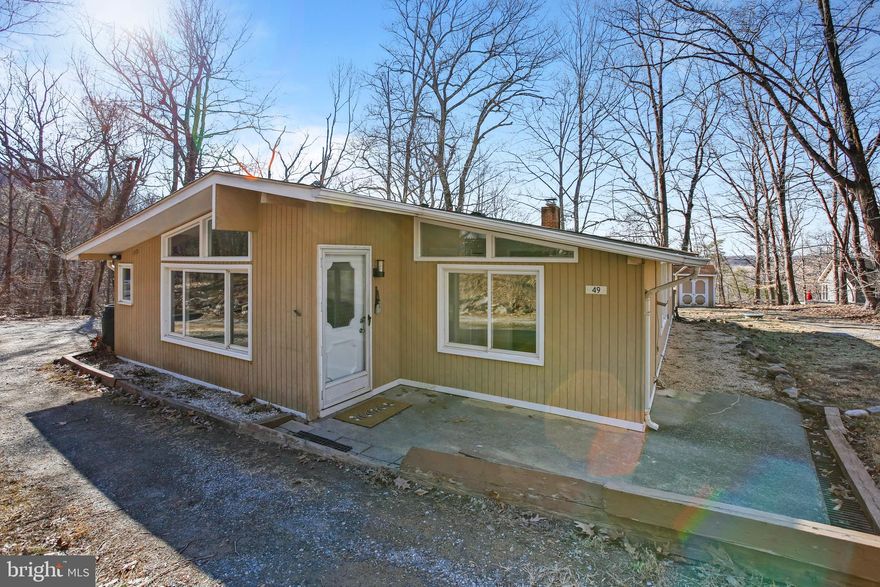 Shenandoah Retreat offers a private river access lot for all owners and adjoins a historical park, Cool Spring. It offers hiking trails, pavilions for outdoor BBQ's. Minutes away you will find wineries and breweries and The Appalachian Trail for outdoor enthusiasts. You can have it all a scenic wooded lot, inviting- main level living,  windows that invite natural light,  2 bed, 1.5 bath, freshly painted ,new  quartz counters, new SS appliances, wood burning fp with insert , Vaulted ceilings ! New LVP flooring thru-out ! !    Shenandoah Retreat Land Corp is a private stock held corporation. It is not a POA or HOA. They maintain the roads throughout the subdivision with an annual fee .Perfect for a primary residence or weekend retreat, This charming cottage offers a tranquil escape on a spacious partially fenced .75-acre combining 3 lots.  Enjoy the  Shenandoah River nearby and take advantage of the close proximity to the Cool Spring Walking Trails and Paths for endless outdoor adventures.   Comcast Internet is available * Conveniently located near Route 7, you’re just a short drive away from local amenities and attractions.