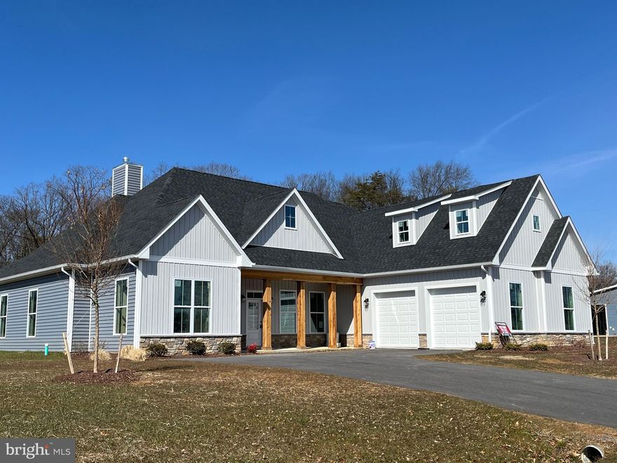 Welcome to this remarkable 5 bedroom, 3.5 bath ranch style home featuring an open floor plan with 10ft ceilings throughout the main level.  The kitchen offers granite countertops, a large island, and a breakfast area with bay windows and features a gas fireplace.  From the kitchen, you can enjoy views of the massive covered patio, seamlessly connecting the indoor and outdoor spaces. The greatness of this home extends to the spacious great room with an impressive vaulted ceiling, where natural light floods the space, creating an inviting atmosphere for relaxation and entertainment. The great room shares the same beautiful views of the covered patio.  The large primary bedroom suite is a true retreat within this home. It offers a sanctuary of comfort and luxury, with a remarkable primary bath and two sizeable walk-in closets. The primary bath features high-end finishes, including a dual-sink vanity, a large soaking tub, and a spacious shower. With this level of sophistication and attention to detail, the primary bedroom suite is designed to provide the ultimate relaxation and privacy. The secondary bedrooms in this home are equally impressive, offering ample space and comfort for family members or guests. Each bedroom provides a cozy and private retreat. Additional features of this home include two additional bedrooms located on the second story, providing even more space and flexibility.  Schedule a tour of this home to see what The Estates at Edgemoor has to offer.