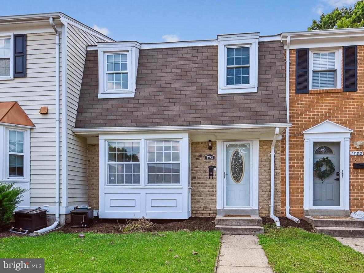 This adorable 3 bedroom, 2.5 bathroom, 3 level, freshly-painted townhouse is move-in ready and waiting for you! Main floor features and updates include a kitchen with a breakfast nook and bay window, new quartz countertops, stainless appliances (new range and microwave), upgraded cabinets, a defined dining area with a coffee station, and new light fixtures throughout. The upper level primary suite includes plenty of closet space and an en suite, renovated bathroom. A bright walkout lower level rec room with sliding door leads to your lovely re-painted deck and fenced yard backing to the woods. You'll find plenty of storage in the utility room and laundry area. One assigned parking space and plenty of open/visitor spaces. New hot water tank. Welcome Home!