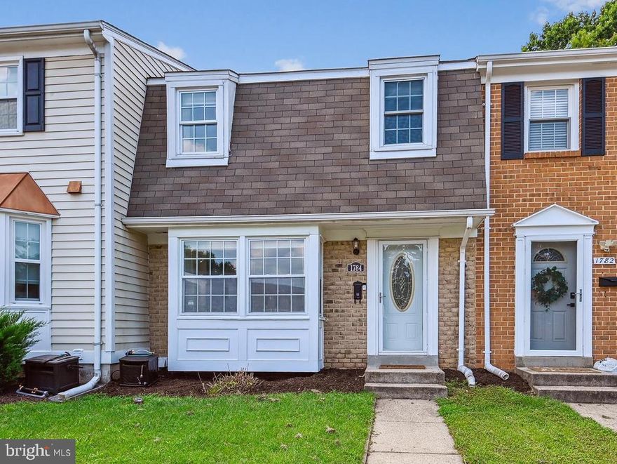 This adorable 3 bedroom, 2.5 bathroom, 3 level, freshly-painted  townhouse is move-in ready and waiting for you! Main floor features and updates include a kitchen with a breakfast nook and bay window, new quartz countertops, stainless appliances (new range and microwave), upgraded cabinets, a defined dining area with a coffee station, and new light fixtures throughout.  The upper level primary suite includes plenty of closet space and an en suite, renovated bathroom. A bright walkout lower level rec room with sliding door leads to your lovely re-painted deck and fenced yard backing to the woods. You'll find plenty of storage in the utility room and laundry area.  One assigned parking space and plenty of open/visitor spaces. New hot water tank.  Welcome Home!