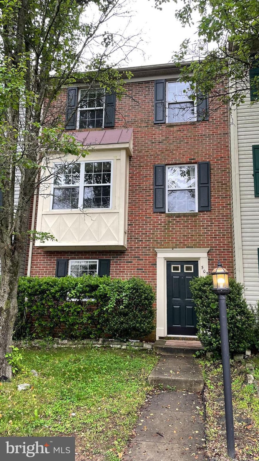 Beautiful brick front townhome backing to trees. Newer carpeting and paint. Main level has eat-in kitchen with gas cooking, an island and pantry. Large living room with built-in window seat. Upper level has 3 beds (all with ceiling fans), including primary bedroom with vaulted ceiling and 1 full bath. Finished basement has another bedroom, full bath,  family room with gas fireplace, and walks out to fenced rear yard backing to trees.