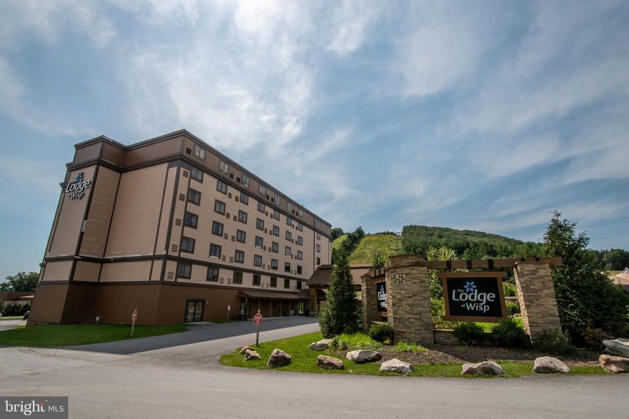 Make the most of every season at Wisp Resort with this spacious, well-maintained condo—one of the larger units in the building—and offering a beautiful view of the slopes. It includes a bonus room with a space-saving Murphy bed and sits just minutes from Deep Creek Lake’s best restaurants, shops, and attractions. Enjoy easy access to ski slopes and chair lifts, along with year-round access to the indoor pool and fitness center. Owners who join the rental program get amazing perks like two season ski and snowboard passes, ten all-day lift tickets, ten snow tubing passes, and two golf memberships to Fantasy Valley Golf Course. Monthly condo fees are waived while the unit is in the rental pool, making this an even more attractive and effortless investment.