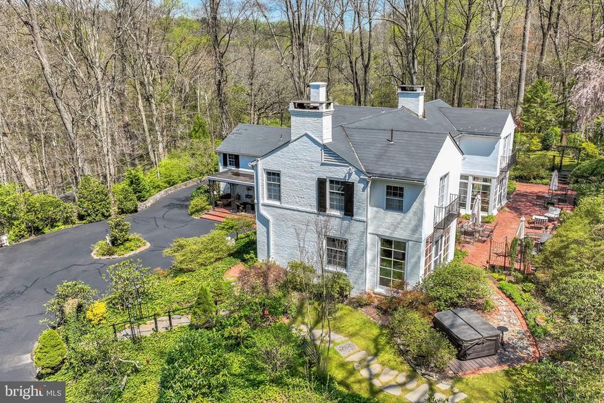 ALL OFFERS DUE SATURDAY, MAY 4, 5:00 PM
If you’re looking for a cookie cutter house and property, Flint Hill is definitely NOT for you. If, however, you are looking for absolutely extraordinary grounds, a thoughtfully laid out floor plan and unrivaled privacy in a location convenient to everything, this property might be the perfect fit. This Walter Durham classic is situated atop a graceful hill and completely surrounded by trees and other vegetation. The fenced (for deer) and gated property leads up the driveway to a large parking area. It continues behind the house to the 2+ car garage. One bay was converted to an artist’s studio, but can be easily returned to a third spot. The path the front door takes you by a lovely covered brick patio—outdoor “rooms” being a signature Durham detail.
Inside, you’ll find hardwood floors and windows as well as updated lighting and surround sound throughout. The large dining room features 3 walls of windows at the far end, creating the feeling of a greenhouse. The focal point is the magnificent brick patio and the rest of the grounds accessed by the French doors. Through the butler’s pantry, the large kitchen provides access to a covered porch for convenient grilling. There is plenty of counter space and a convenient island. Just past the kitchen is an unexpected family room with an informal eating area, a large, but cozy sitting area and lovely cherry floors.
The other side of the house leads past a cozy den/library with built-ins and a fireplace as well as French doors to the rear patio. Next is the large living room which has plenty of room for multiple seating areas and offers another fireplace. It gives way to a lovely sun porch, which also features French doors to the back. This section of the house is all air and light.
Upstairs, the primary suite is truly luxurious. The current owner incorporated what had been a fourth bedroom into this space and created a generous dressing area with gorgeous wood built-ins, a walk-in closet, tray ceiling over the bed, and plenty of upgraded lighting and a fireplace. The suite offers the luxury of both a powder room and separate full bath that features heated floors, a large shower, separate tub and balcony with French doors.
Across the hall, you’ll find two more bedrooms with an updated hall bath in between. The rear bedroom had the roof raised and was extended out the back. The owner added a balcony to mirror the one in the primary bath. This bedroom offers the experience of being in a treehouse. The owner added additional closets in the third bedroom and it is still quite spacious and comfortable.
The basement houses a laundry room, a gym, large crawl space used for storage, utilities and the entry to the artist’s studio and garage.
Outside, the grounds are truly breathtaking. Several arbors, stone stairways, perennial beds, sitting “rooms” and paths make this property different from anything else you’ll see. The owner has added a (tasteful) hot tub that is invisible from inside the house and she has installed watering stations, outdoor lighting and power so the outside functions as both a refuge and/or a perfect spot to host any size gathering. There is even a newly rebuilt deck attached to the shed.
If you’ve been searching for special property, come see Flint Hill. You won’t be disappointed.