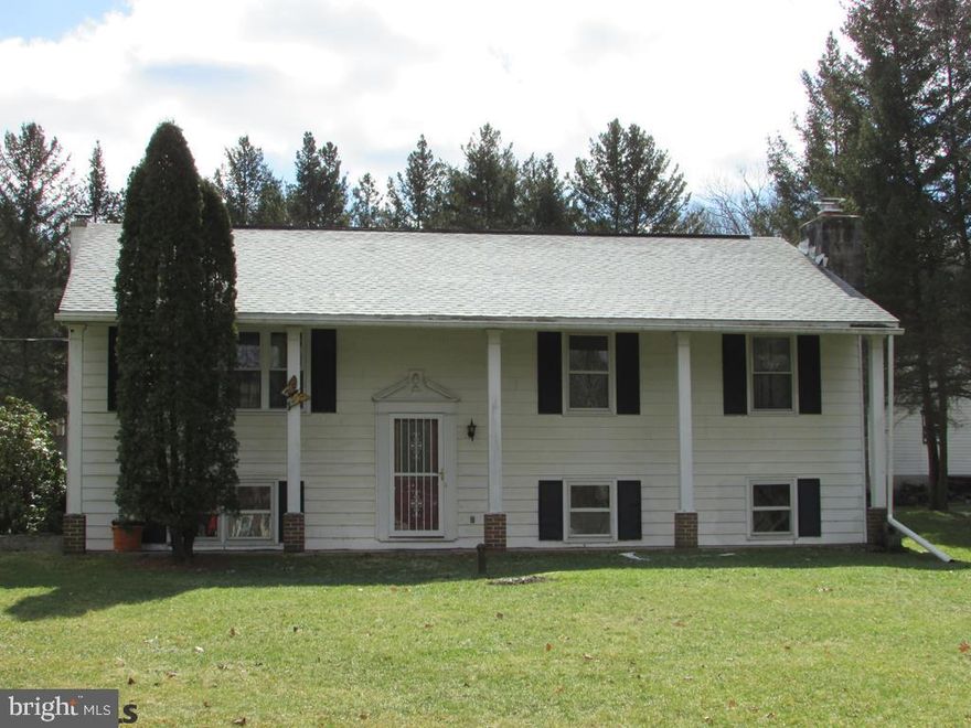 Carpet upstairs in the living room, and hallway has wood floors underneath.The master bedroom on the main floor along with the other two bedrooms have hardwood floors.The lower level has a beautiful wood inset fireplace encompassed by brick.  Visit Virtual Tour at https://rem.ax/2GeqBUH