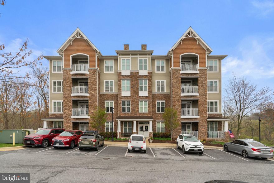 Welcome to 17 Clay Lodge Lane #304, a beautifully maintained condo located in the desirable 55+ community of Patapsco Overlook. Situated on the third floor, this home offers the perfect combination of comfort, convenience, and low-maintenance living, all within an active and welcoming community setting.
Inside, you’ll find a thoughtfully designed one-level layout featuring an open-concept kitchen, living room, and dining area—ideal for both everyday living and entertaining. The kitchen is well-appointed with stainless steel appliances, including a French door refrigerator and double oven range, along with quartz countertops, a mosaic tile backsplash, and abundant cabinet space to keep everything organized.
The main living area features engineered hardwood flooring, recessed lighting, and crown molding, creating a warm and inviting atmosphere. Just off the dining room, French doors lead to a versatile den that can easily function as a home office, reading room, or hobby space.
The spacious primary suite offers a comfortable retreat, complete with plush carpeting, a large walk-in closet, and three additional closets—providing exceptional storage options. The attached primary bathroom features a dual vanity, a tub/shower combination, and a separate stall shower for added convenience. A second bedroom and a full hall bathroom with a stall shower offer comfortable accommodations for guests.
Step outside through French doors to your private balcony, where you can unwind while enjoying peaceful tree-lined views and beautiful sunsets in the evenings. Additional conveniences include an in-unit laundry closet, a dedicated one-car garage, and a separate storage unit.
Residents of Patapsco Overlook enjoy access to a shared clubhouse with an exercise room, as well as an active condo association that fosters a connected community. Ideally located, this home offers easy access to both Catonsville and Ellicott City, where you’ll find a variety of nearby dining, shopping, and entertainment options.
If you’re seeking easy living with thoughtful features and a strong sense of community, this well-cared-for condo is ready to welcome you home.