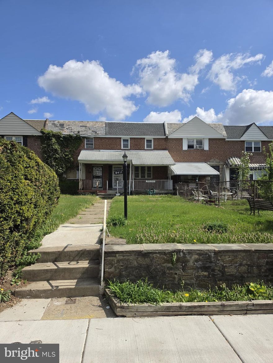 Exceptional Opportunity – End-Unit Investment with Massive Upside

Welcome to 8411 Thouron Avenue—an exceptional opportunity to reimagine a classic Philadelphia brick end-unit townhome and unlock its full potential. Offering approximately 1,120 square feet, this 3-bedroom, 1 full and 1 half-bath home is the perfect canvas for investors, renovators, or savvy buyers ready to create value.

The timeless brick façade and corner positioning provide added privacy, abundant natural light, and a strong presence on a well-established residential block.

Inside, the main level features a traditional layout with a spacious living and dining area that flows seamlessly together. Original hardwood floors run throughout, ready to be restored, while natural light highlights charming architectural details, including an arched entry into the dining room with built-in cabinetry.

The kitchen offers a functional footprint with solid bones—ideal for a modern redesign that maximizes both style and efficiency.

Upstairs, you’ll find three well-sized bedrooms with hardwood flooring and great natural light. The primary bedroom features dual windows and a comfortable layout, while two additional bedrooms offer flexibility for guests, office space, or added resale appeal. Two full bathrooms on this level provide convenience and the opportunity for high-impact upgrades.

The partially finished basement adds valuable additional living space, complete with a half bath and room to create a recreation area, workspace, or extended living quarters.

As an end-unit, the home benefits from added side exposure and a more open feel compared to traditional rowhomes. Exterior space offers further potential for landscaping or outdoor enhancements.

Conveniently located near shopping, dining, and major routes, this property combines accessibility with strong investment potential.

Being sold AS-IS, WHERE-IS. Buyer responsible for all inspections and any city requirements. All information is deemed reliable but not guaranteed and should be independently verified.

This is more than just a property—it’s a value-add opportunity ready for transformation. Schedule your showing today.