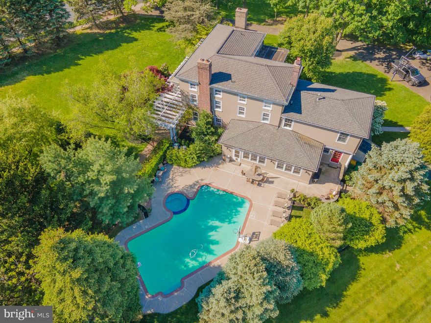 Welcome to 676 Gage Ln, located on 1.2 acres in the coveted Upper Gwynedd township, this historic masterpiece has it all! Built in 1894 this is an original farmhouse with the highest quality craftsmanship and design that’s been impeccably maintained, offering unique features around every corner. Now is your chance to own a piece of history and the current owners have literature that has been passed down, outlining the history of the property and the Gage Family! Approaching the U-shaped driveway you will be greeted by two stone pillars and mature trees. Step onto the quaint brick walkway which leads you to the impressive pergola embellished with mature wisteria. Entering this center hall colonial, the main level opens to a spacious living room on the left with Mercer tiled wood-burning fireplace, built in wood shelving, and 6 in 1 windows with deep sills. Continue through the main level to find the large formal dining room featuring original knotty pine shiplap and built-ins, a wood-burning fireplace, an antique cut crystal chandelier, and an oversized pocket door. Next door, you’ll find the light-filled gourmet kitchen with updated custom cherry cabinetry, 48 Thermador gas stove with double oven, Sub Zero Fridge and 2 Freezer drawers, granite countertops, stunning built-ins, and an island to seat 6. Off the kitchen is an airy room perfect for a home office or children's playroom, with access to your lovely wrap-around porch. Enjoy mornings in the spacious breakfast room looking out to your private yard with $50,000 plus Anthony Sylvan heated in-ground pool and spa with a new heat pump and filter. Walkthrough to the large family room with exposed brick and built in speakers (kitchen, breakfast area, and living room all have built in speakers). Entering the rear of the home you’ll find a tiled mudroom, powder room, and door leading to the detached spring house. FUN FACT: The springhouse was a key site for dairy work. It was constructed of masonry or frame over a spring or over a running stream. Spring houses served for storage, dairy processing, or sometimes even residential quarters. The point of the springhouse was to provide a cool space and fresh water. Moving to the second level, the master suite has a walk-in closet, and a master bathroom with Carrera marble, double vanities, a marble tiled shower, and a separate water closet (toilet). The second floor also features three additional bedrooms and an updated full bathroom. Finally, the third floor has three bedrooms, a full bathroom, and cedar-lined closet space.  The unfinished basement is massive with ample storage and laundry. 676 Gage Lane is a part of the North Penn School District, located minutes from Parkside Place Park, Green Ribbon Trail, North Wales Train Station for anyone commuting into center city Philadelphia, Merck, Blue Bell Country Club, downtown North Wales, and the Nor-Gwyn Pool. Schedule your showing today to experience the charm and character of this historic home!