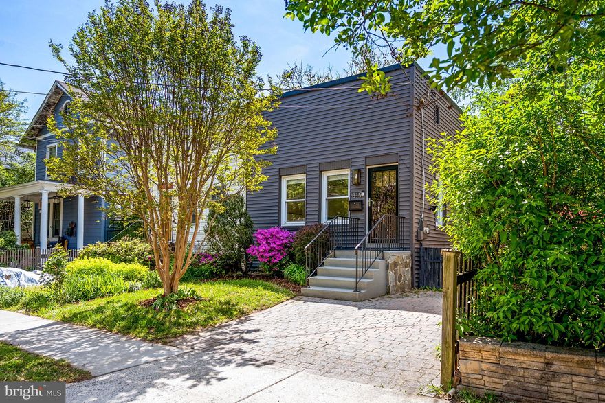 Welcome to 319 Hume Avenue – Timeless Character in the Heart of Del Ray. This classic 1950s brick duplex combines historic charm with thoughtful modern updates, offering 2 bedrooms + Den, 2 full bathrooms, and a flexible layout ideal for comfortable living and entertaining. 

The main level features a bright, open living area with hardwood floors, generous natural light, and a beautifully renovated kitchen complete with white quartz countertops, stainless steel appliances, and solid brass hardware. The open breakfast bar provides a welcoming space for casual dining and conversation. Two well-proportioned bedrooms and an updated full bath complete the main level. The lower level offers additional living space, including a spacious second living room, a fully renovated bathroom, and a bonus room perfect for a home office, guest space, or workout area. A large utility room provides practical storage and laundry convenience. Step outside to a private, fenced backyard—ideal for entertaining, gardening, or simply relaxing. Located just steps from Del Ray’s beloved shops, dining, and community events, 319 Hume Avenue offers a walkable lifestyle in one of Alexandria’s most sought-after neighborhoods. With easy access to Metro, Old Town, and D.C., this home blends the best of neighborhood charm and city convenience.

A true Del Ray gem—ready to welcome you home!