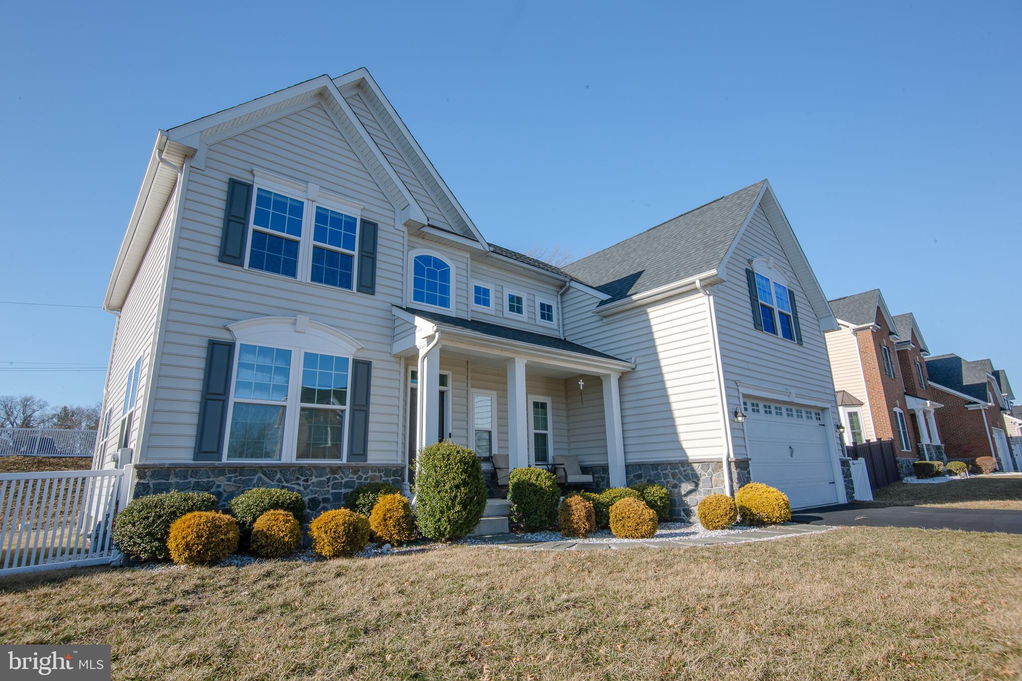 Spring price reduction and seller's assistance considered. Beautiful home built 07/2017, like new. Quaint neighborhood of Mill Creek Estates is where you'll find 1032 School Lane with 5 beds and 2.5 baths. The front porch welcomes you into the bright and sunny 2-story foyer featuring a turned staircase. The main level has gorgeous hardwood floors throughout, 9 ft. ceilings, and provides a formal living room, huge dining room big enough for those family style dinners, play room/office, powder room, and coat closet. The main feature, of course, is the gourmet kitchen with a sun-drenched breakfast area that looks over the great room. The kitchen boasts plenty of cabinet space, granite countertops, stainless steel appliances, gas cooking, an island with overhead pendant lights, seating, and a double sink. Kitchen cabinets currently have 5 years left on warranty. Finished basement has an egress window and provides a rec/game room area and fitness room, along with plenty of unfinished storage area. Pool table with cover, Tonal Exercise system, ping pong table, basketball hoop and backboard & snow blower are included in the sale as-is. Outside is great for entertaining with a huge Trex deck and side patio with a fire pit area. This home features a 2-car garage and driveway parking, providing plenty of space for cars.