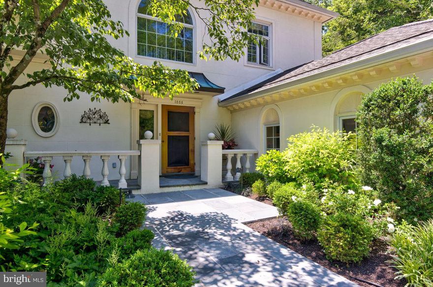 This elegant Wrenfield property is nestled high on a secluded lot tucked away in one of the most private & scenic locations within the community. Exterior grounds feature a terrace that opens to a swimming pool w/hot tub ensconced by professionally designed & maintained gardens & flower beds. The stunning interior matches the grandeur of the exterior w/tasteful decor & updates throughout.

Enter the home via a soaring 3 story foyer accentuated by a sweeping, turned staircase & crystal chandelier. Formal powder room & coat closet are located within the foyer along w/access to the elevator running from basement to 2nd floor.

Natural light bathes this property, & the hardwood floors & flowing layout of the first floor enhance the open feeling of the space. Step down to the large living room & sitting room w/high ceilings & tall, expansive window openings offering sweeping views of the terrace, pool, & grounds. A propane fireplace makes this space warm, cozy, & inviting. 

Arched doorways provide access to the dining room making the home outstanding for entertaining large dinner parties. The dining room is properly adorned w/crown moulding & another beautiful chandelier. French doors lead to the terrace adding to the flow for entertaining and enjoying the exterior.

The kitchen is stylish & functional featuring granite countertops & island, glass paned cabinets & Sub Zero refrigeration all elegantly veneered match the cream colored cabinetry. A mud room is located off the kitchen & provides ground level access to the 2 car garage.

A sun drenched breakfast room w/built-in cabinetry is located off the kitchen & opens out to the terrace. This space makes a comfortable corner to dine  while complementing the functional design for entertaining large groups inside & outside the home.

The finished basement is well thought out, w/access provided both by the stairs & the elevator. An unfinished space offers ample storage w/built-in shelving. A powder room is located conveniently on this floor. Ample lighting and many built-in cabinets & bookcases add to the warmth & function of this space. There are four separate areas to enjoy- a large home office, a media space, a dining nook, & a fitness room.

On the second floor a family room offers another inviting place to gather, served by the elevator- just outside. Built-in entertainment center & bookcases add utility & stylish design to the room. Natural light soaks this room & views of the rear exterior greenery & pool make it a bright and comfortable space to enjoy.

The primary bedroom suite is spacious & well equipped w/a dressing area fully fitted w/granite topped built-in cabinetry &  a walk-in closet outfitted w/space maximizing closet organization. Primary bath features a large soaking tub, stall shower, dual sinks & expansive counter space. A bright space made private by plantation style, louvered blinds. A second bedroom suite located on the second floor offers a large, walk-in closet & bath with shower stall and second floor laundry. 

The third floor offers an open & flexible space that could be utilized as a third bedroom suite or a quiet retreat for a myriad of uses. A shuttered opening to the 3 story foyer adds to the charm & airiness of this space, w/windows facing the rear grounds allowing natural light to warm the space. A large walk-in closet offers more storage & the full bath allows the potential for use as a guest suite.

This home has been lovingly maintained and is in excellent condition. A generator offers peace of mind & makes this property truly a sanctuary. More details & specifications can be provided upon request.