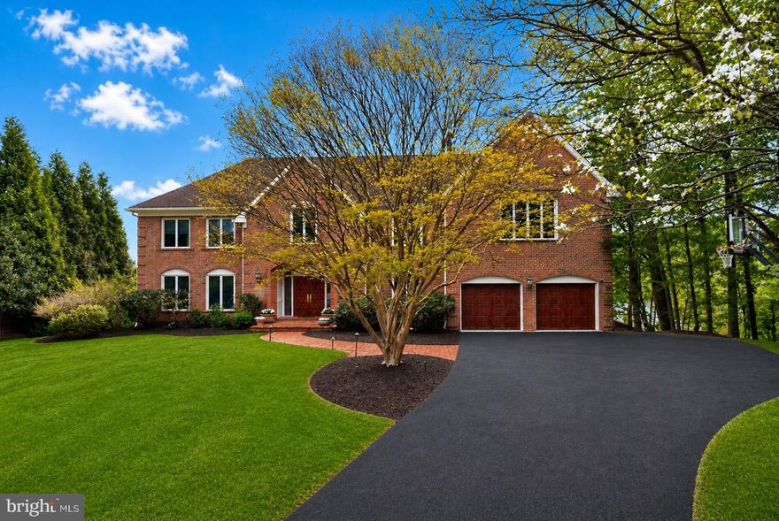 Tucked away on a quiet cul-de-sac in the heart of Bethesda, this remarkable offering presents a rare opportunity to own a stately, all-brick colonial in the highly sought-after Churchill school cluster. Boasting six bedrooms, five full baths, and one half bath, this impressive residence offers over 8,000 square feet of refined living space designed for both elegant entertaining and comfortable everyday living. Freshly painted throughout, the home seamlessly blends timeless architectural details with a modern, open floor plan. Rich hardwood floors, beautifully updated bathrooms, and thoughtful finishes elevate every level of the home. The main level is elevated by a stunning sunroom addition that fills the home with natural light and creates a seamless flow between the formal living and dining rooms and the more relaxed everyday living spaces. A stately wood-paneled office on the main level offers a sophisticated and private space, ideal for working from home or quiet study. The inviting family room features a stunning stone fireplace, custom-crafted wood built-ins and sliding glass doors that open to the back deck, creating a seamless connection between indoor comfort and outdoor living.Upstairs, four generously sized bedrooms provide ample space, including a luxurious primary suite complete with brand-new carpeting and a spa-like atmosphere. The fully finished walkout lower level expands the home's versatility, featuring two additional bedrooms, expansive recreation areas, gym space, a kitchenette, and fresh carpeting along the stairway, offering a welcoming retreat for guests or extended family. This home stands apart with features rarely found in the neighborhood, including 9-foot ceilings on the main level-an upgrade from the standard 8-foot ceilings-along with upgraded windows and sliding doors. Modern conveniences abound, from decora-style outlets and switches throughout to a sophisticated lighting system with LED upgrades and partial smart control integration. A fully integrated distributed audio system enhances key living spaces, while a comprehensive wired and wireless network with multiple access points ensures seamless connectivity throughout the home and outdoor areas. Security and efficiency are thoughtfully addressed with a recently inspected and approved security system, a full camera setup with front and rear coverage, video doorbell, and in-home DVR access. Additional highlights include an epoxy-coated garage floor, a dedicated HVAC zone for the primary suite, and a well-appointed lower-level inlaw suite featuring full windows, a private entry hall, walk-in closet, heated bathroom floors, and its own dedicated HVAC split system. Significant upgrades further enhance the home's value and appeal, including the addition of the sunroom, deck, and expanded lower-level space with soaring 9+ foot ceilings-ideal for a future golf simulator or home theater-completed in 2014. The roof and garage doors were also updated in 2014, with garage motors and coils replaced in 2021. A newly installed generator in 2023 provides backup power to essential areas, including the primary suite, kitchen, garage, lighting, and network systems. The primary bathroom was tastefully renovated in 2009, while a new powder room and two upstairs bathrooms featuring Toto and Waterworks fixtures were completed in 2021. This exceptional property offers a rare combination of space, craftsmanship, and modern amenities in one of Bethesda's most desirable locations. Nestled within the prestigious residential pockets of Bethesda, Charred Oak Estates offers a rare blend of privacy, space, and convenience. Ideally positioned with quick access to I-495 and I-270, the neighborhood provides seamless connectivity to Northern Virginia, Washington, D.C. and the surrounding region, while remaining just minutes from the vibrant amenities of Downtown Bethesda.
Schedule your private tour today to experience all that this extraordinary home has to offer.