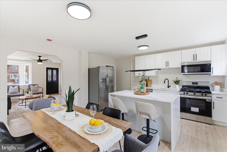 Beautifully renovated 4-bedroom, 2 full bath end-of-group rowhome in desirable North Bend! This light-filled home features an abundance of natural sunlight, highlighted by two stunning bay windows — one in the living room and one in the dining room — creating bright and welcoming spaces throughout.

The updated kitchen is designed for both style and functionality, offering quartz countertops, a spacious island, stainless steel appliances, and gas cooking. Step right out to the deck off the kitchen — perfect for entertaining or enjoying outdoor dining.

Upstairs, you’ll find three comfortable bedrooms with plush carpeting and a fully renovated bath featuring modern finishes.

The finished lower level provides a versatile fourth bedroom along with additional finished space ideal for a home gym, office, or recreation area.

Relax on the charming front porch — the perfect spot for morning coffee or evening cocktails. With thoughtful updates, generous living space, and incredible natural light, this home is truly move-in ready!