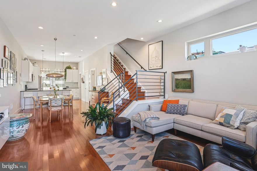 Welcome to 2567 E Thompson Street, a modern, well designed, twin home completed in 2018, with approximately three years remaining on the tax abatement. This home features a coveted dedicated PARKING spot right outside your back door. Step inside to a bright and airy living space featuring solid hickory hardwood flooring, 9' and 10’ ceilings, oversized windows – complete with custom fitted shades, and recessed lighting throughout. The living area is outfitted with a custom California Closet built-in storage and entertainment center, and extra side windows for additional natural light. The open layout flows seamlessly into the dining area with easy seating for 6-8. The kitchen is at the rear of the home, where you’ll find white shaker cabinetry, dark gray quartz countertops, a Whirlpool stainless steel appliance package, including a gas range, room for 4 countertop seats, and a walk-in pantry with custom shelving from Closetworks.  A convenient powder room and sliding glass doors to the rear complete the main level. The finished basement offers even more living space, with its own powder room and egress.  Two bedrooms with double closets and a full bathroom are located on the 2nd level.  The laundry room with an Electrolux washer & dryer and the added 2nd zone HVAC unit, is also on this level, along with TWO additional linen/storage closets.  Upstairs, the spacious primary suite easily fits a king-sized bed and includes a generous walk-in closet with more custom shelving. The ensuite bathroom is a spa-like retreat with a floating dual-sink vanity, soaking tub, and glass-enclosed shower with triple shower heads.  For added convenience, there is another powder room and large closet on this floor to accommodate guests when entertaining on the roof. The full, private roof deck with stunning views of the Center City skyline and unobstructed 360° views completes this exceptional home.  This convenient location puts you close to all the shops, cafés, and restaurants that make Fishtown one of Philadelphia’s most vibrant neighborhoods. Local walkable favorites include Il Ghiottone, Picnic, Bastia, Riverwards Produce Market, Czerw’s Polish Kielbasa, Starbucks, your friendly local IGA, and so much more. And with easy access to I-95, 676, Delaware Ave, and the Market-Frankford Line, this home has it all!