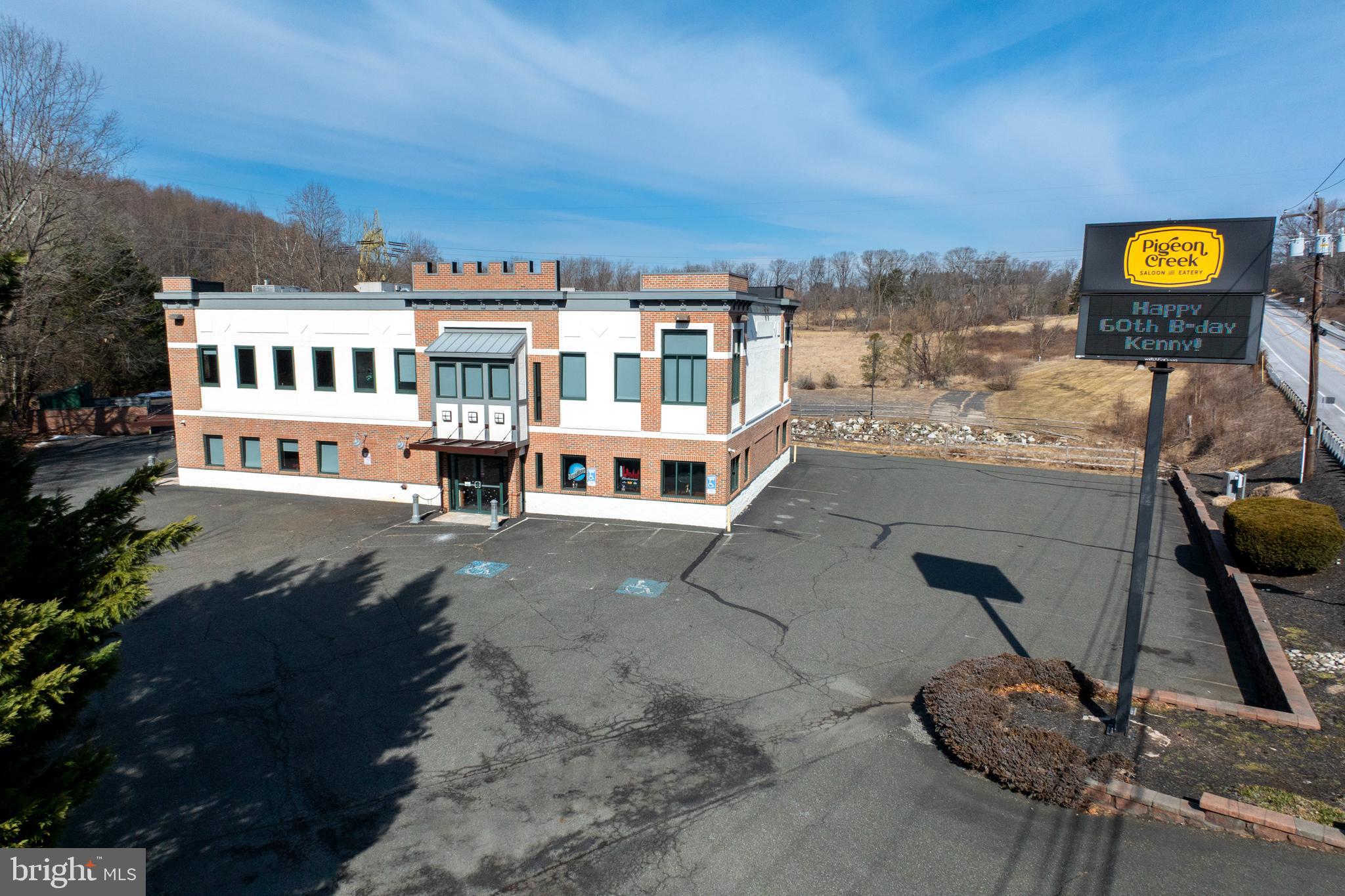 Exciting opportunity to own a noteworthy Chester County venue. Situated with great visibility along Rt 100 in South Coventry Township, this property has been home to several notable establishments. Currently, it houses Pigeon Creek Saloon & Eatery, a innovative American eatery celebrated for its delectable menu, scratch kitchen, draft beers and live music. This is a prime location with convenient access to major highways and local amenities. Interior is well appointed and tastefully decorated with natural wood and impressive open two story bar area. With a full liquor license already in place, the foundation for a successful business is ready to go. The modern kitchen is well equipped and the 7,276 square foot interior comfortably handles a 232 person occupancy. Ample parking for 105 cars in the main and rear lots. Whether you're looking to establish a new business, expand your current operations, or invest in a property with significant potential, this location offers the flexibility and visibility you need. Remarkable building with expansive outdoor area. The opportunities are endless. Owner has a stage that can be placed over the main bar for performances. Sale includes liquor license. AKA: 1703 Pottstown Pike